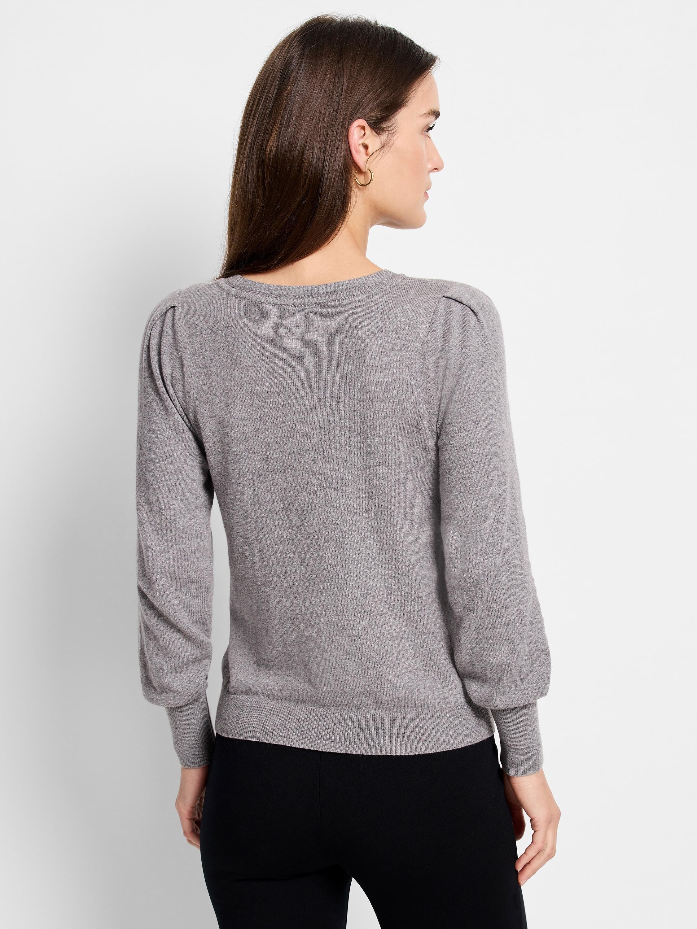 Grey fine knit sweater with puff sleeves, ribbed crew neck, cuffs, and hem.