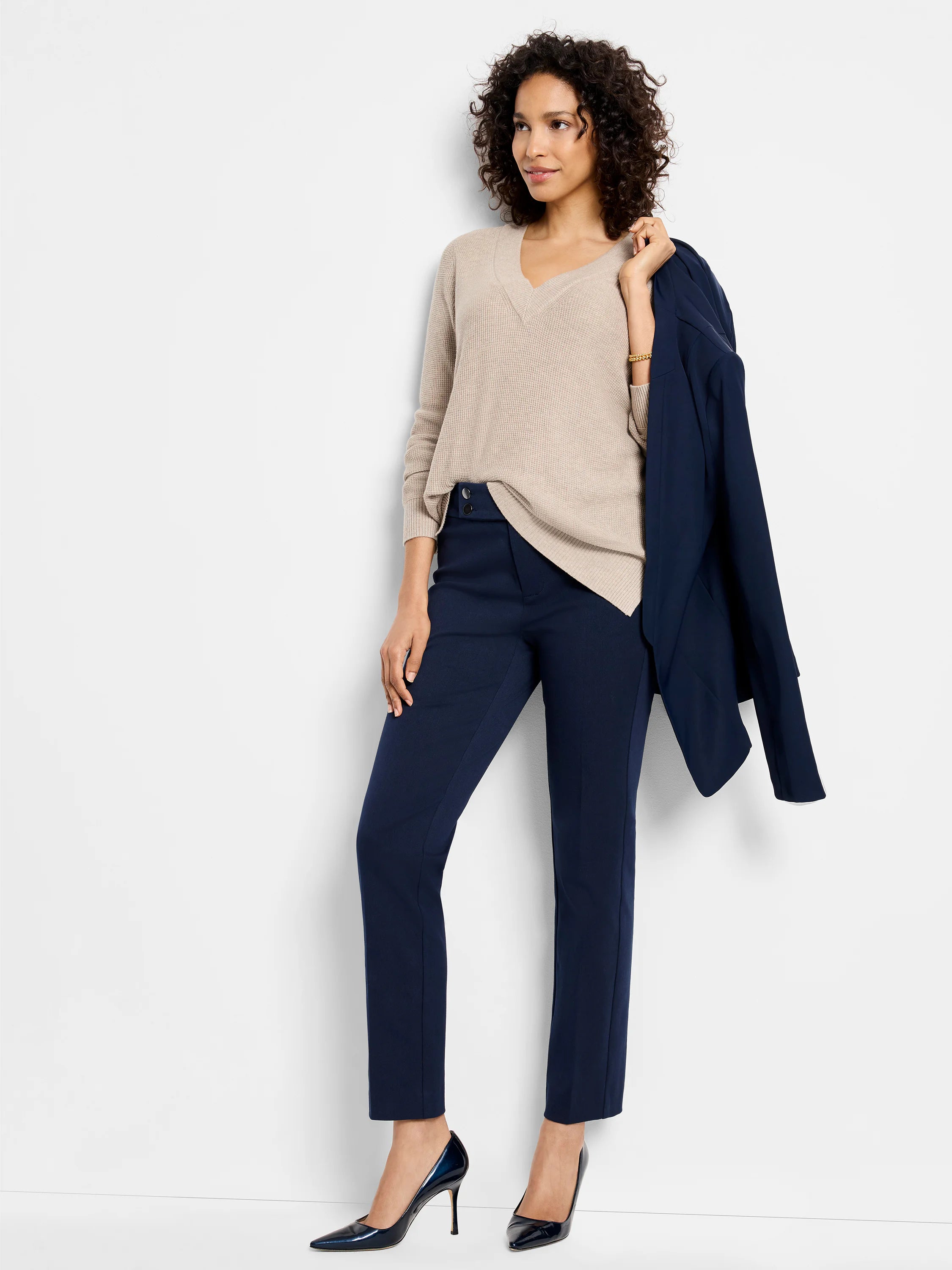 Beige waffle stitch V-neck sweater, relaxed fit, with a slight dip-back hem and split sides.