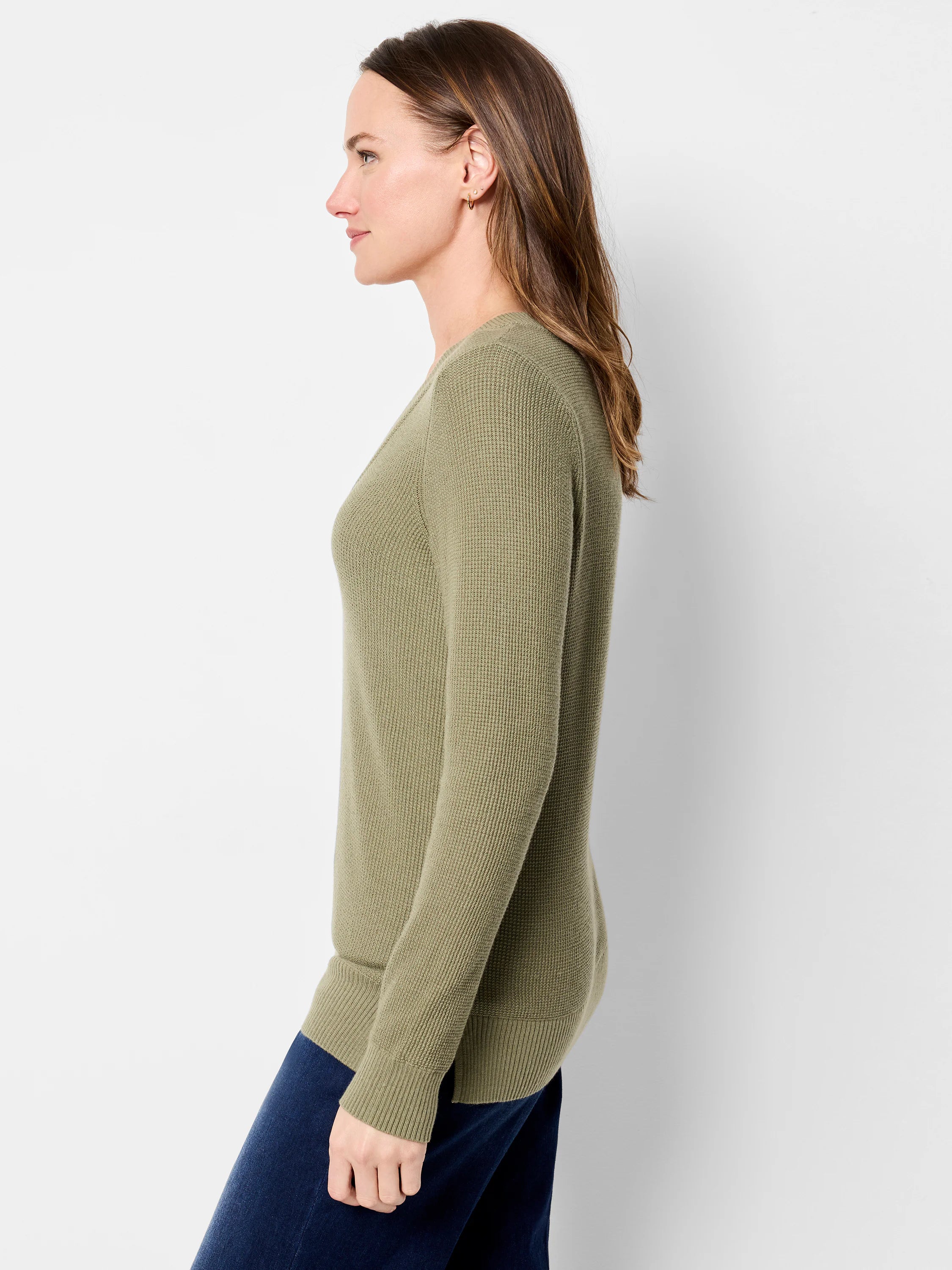 Olive green waffle stitch V-neck sweater with long sleeves.