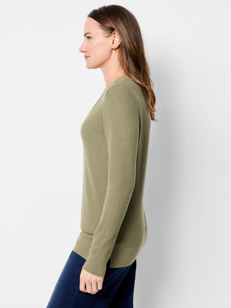 Olive green waffle stitch V-neck sweater with long sleeves.
