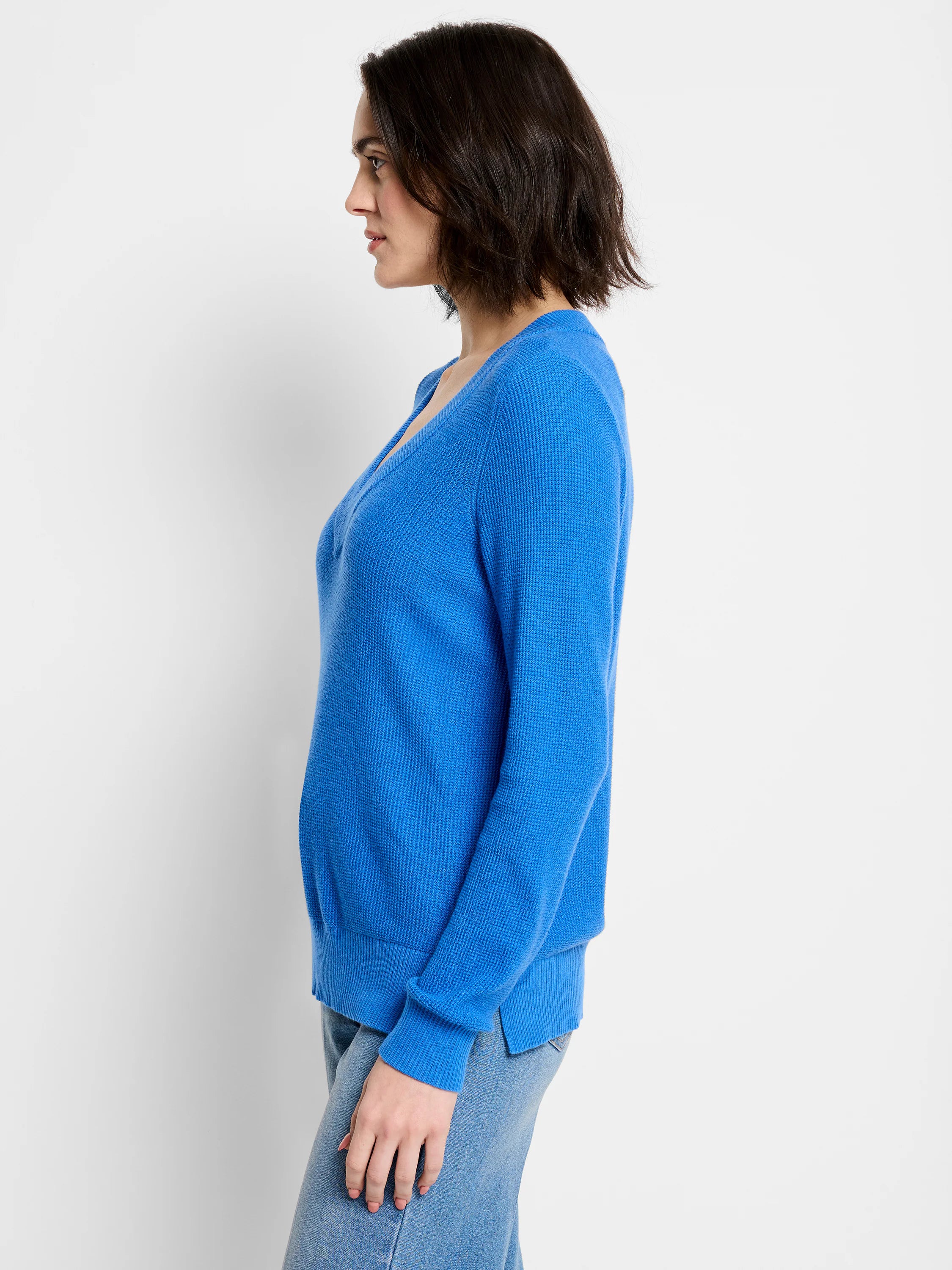 Bright blue waffle knit V-neck sweater with a relaxed fit.