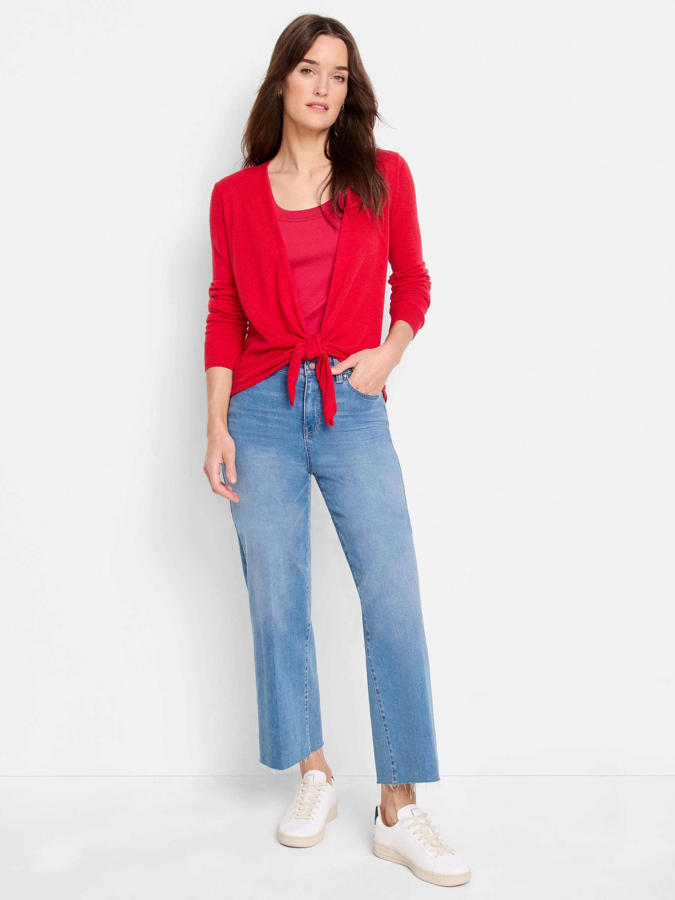 Red long-sleeve 4-way cardigan, tied at the front over a matching red top. Ribbed cuffs visible.