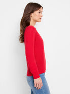 Red long-sleeved cardigan with a crew neck. Features a smooth, fine knit texture.