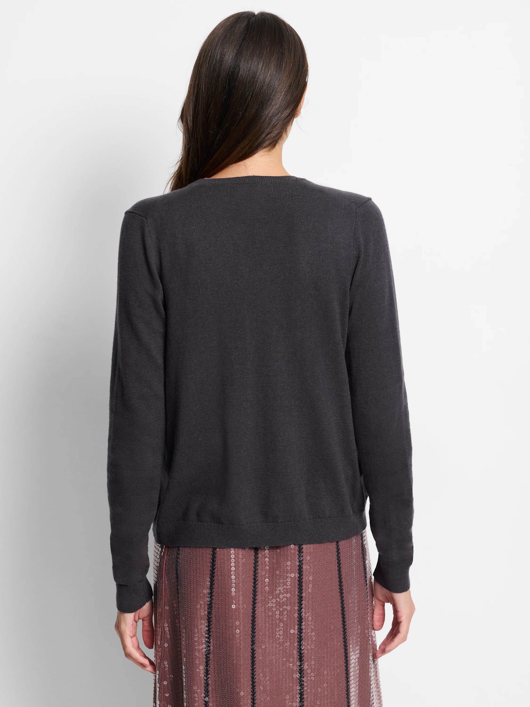 Dark gray cardigan, long sleeves, sequined trim. Back view.