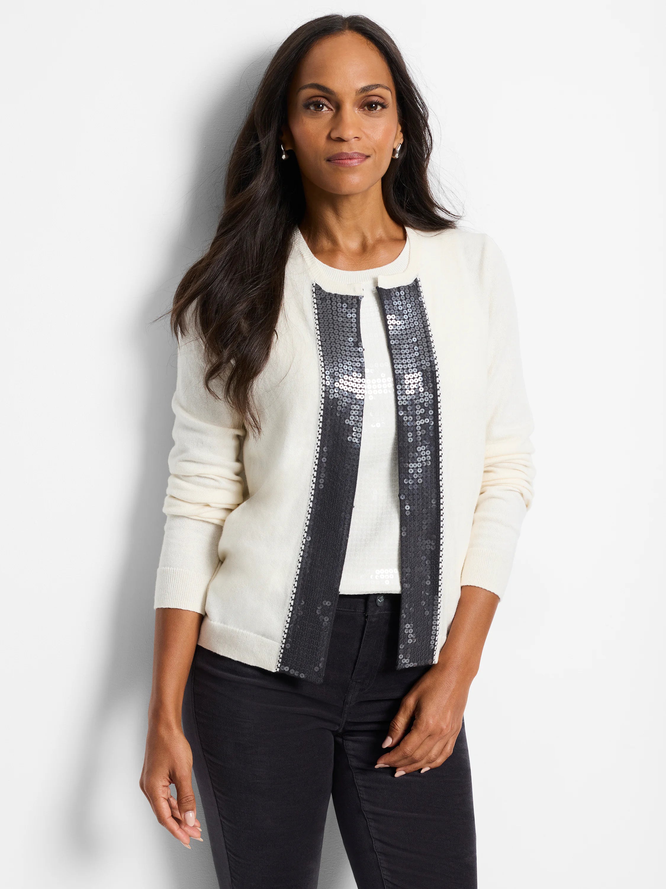 Off-white cardigan with dark gray sequin trim down the front.