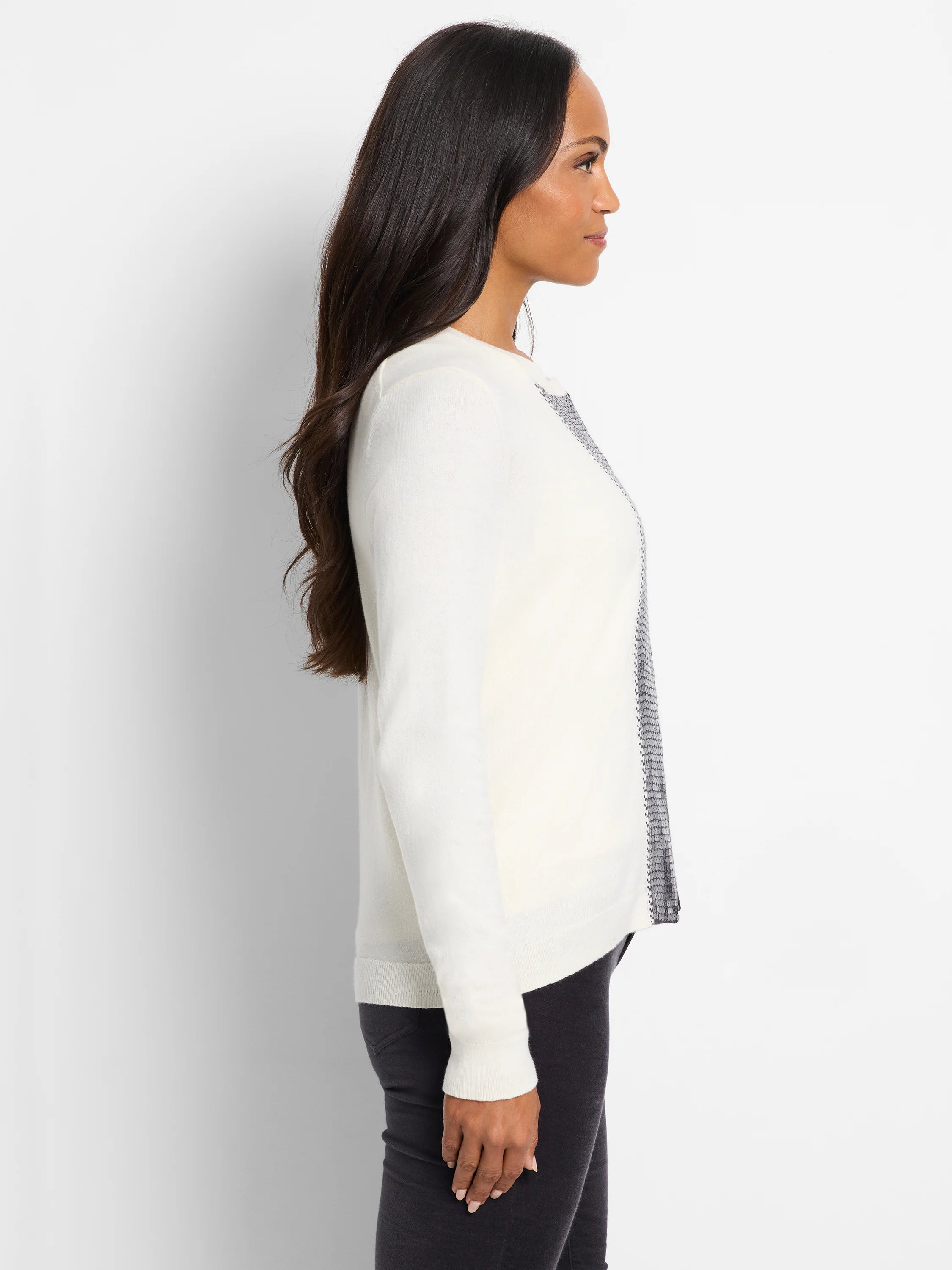 Off-white cardigan with silver sequin trim along the front, shown on a model.
