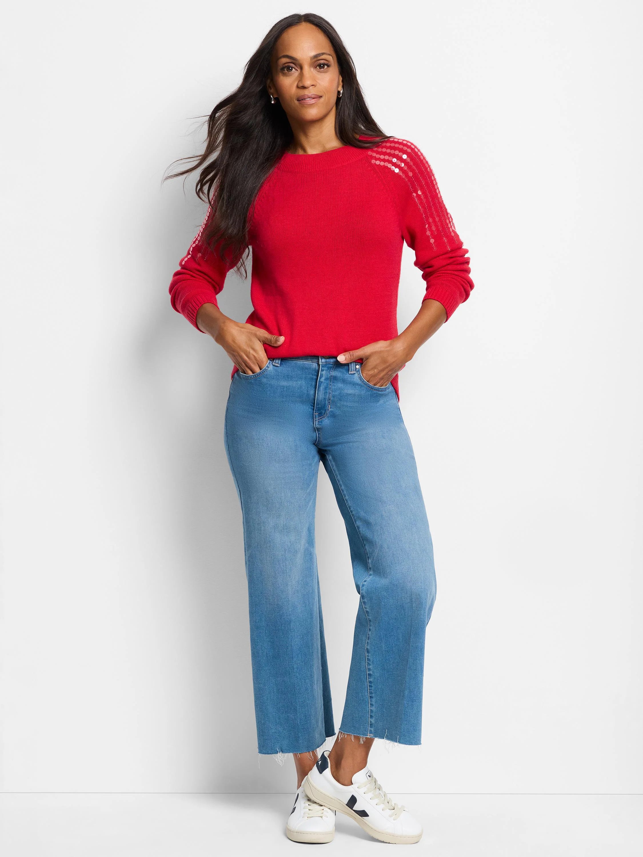 Red sweater with sequined shoulder detailing.