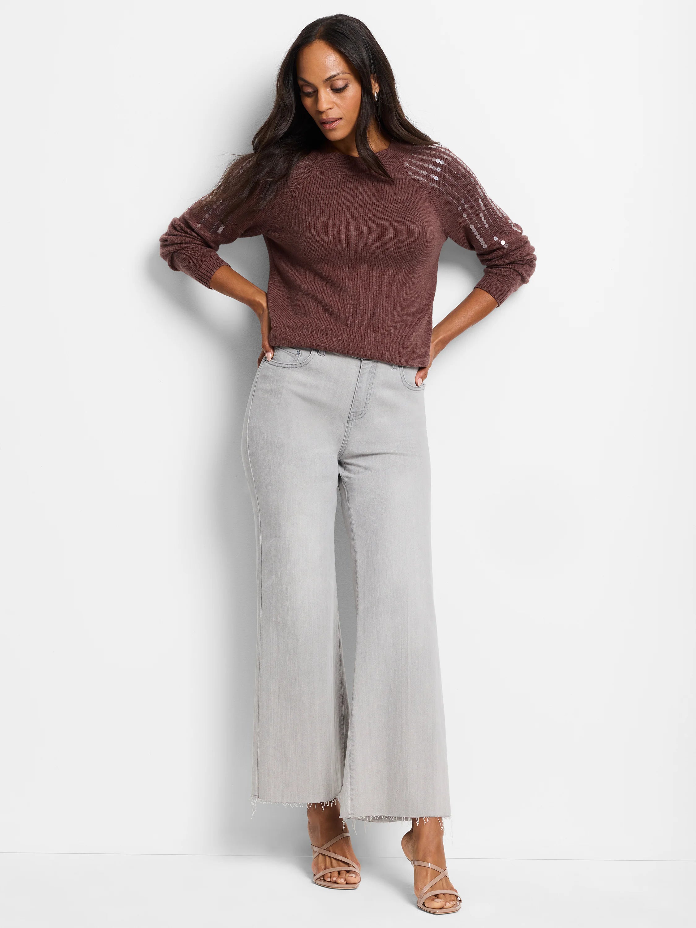 Brown sweater with light silver sequins on shoulders.