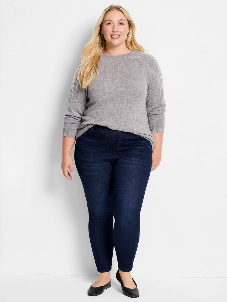 Here's alt text for the image, suitable for visually impaired users:
"Gray sweater with lighter gray detailing on the...
