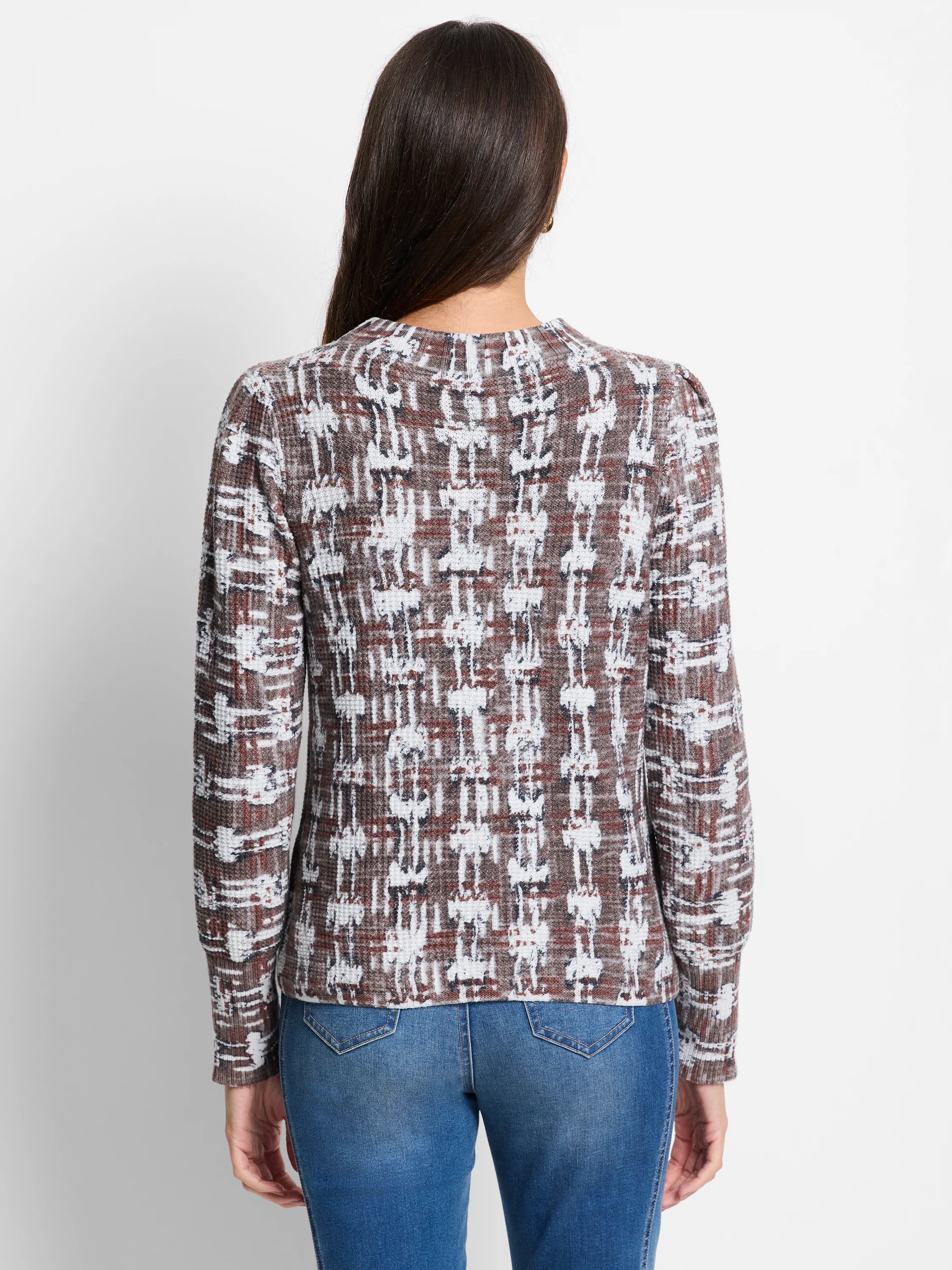 Brown, white, and rust waffle-knit sweater. Features a textured, abstract pattern. Long sleeves, crew neck.