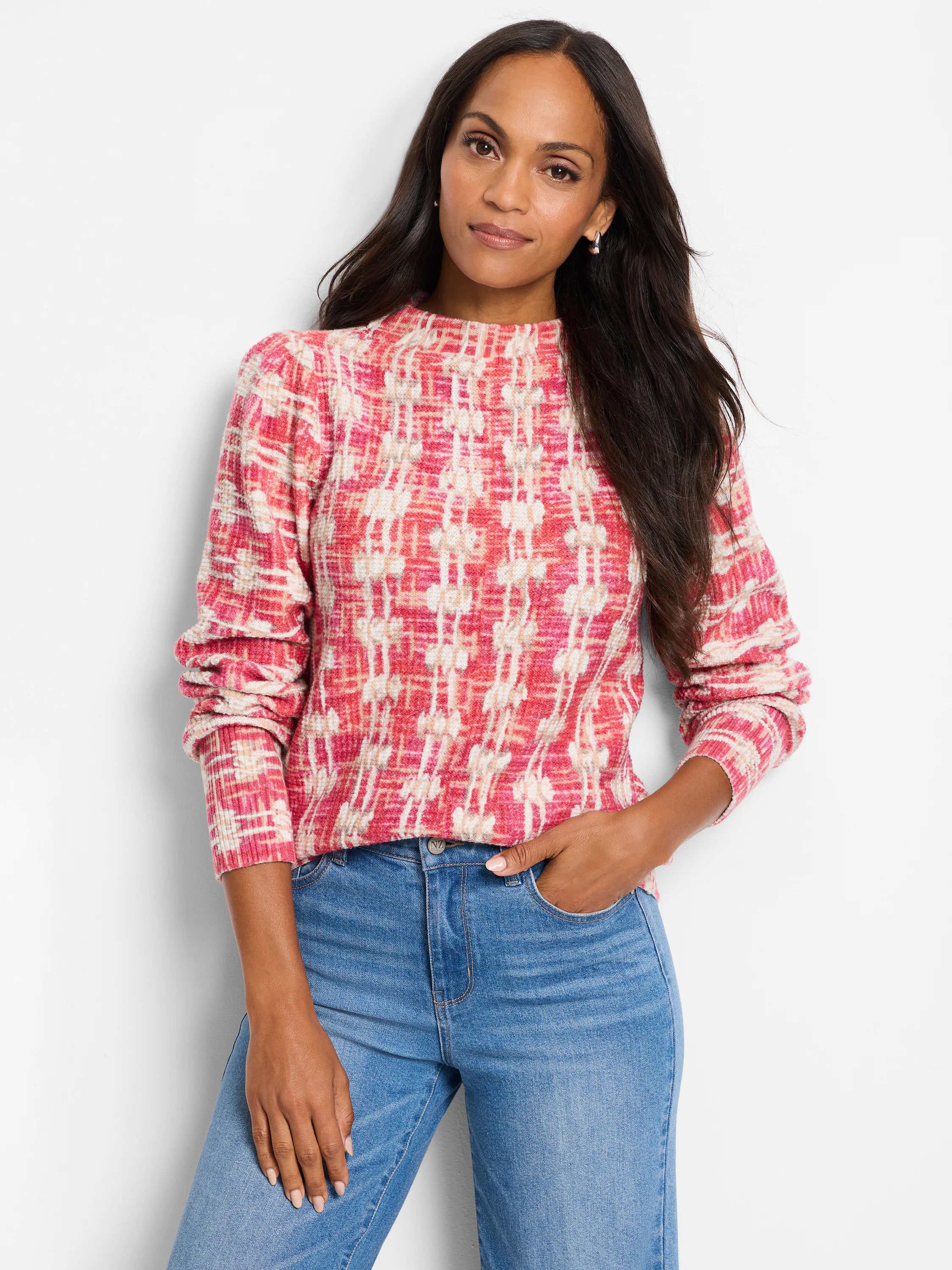 Pink and cream waffle-knit sweater with a mock neck and long sleeves. A textured, plaid-like pattern.