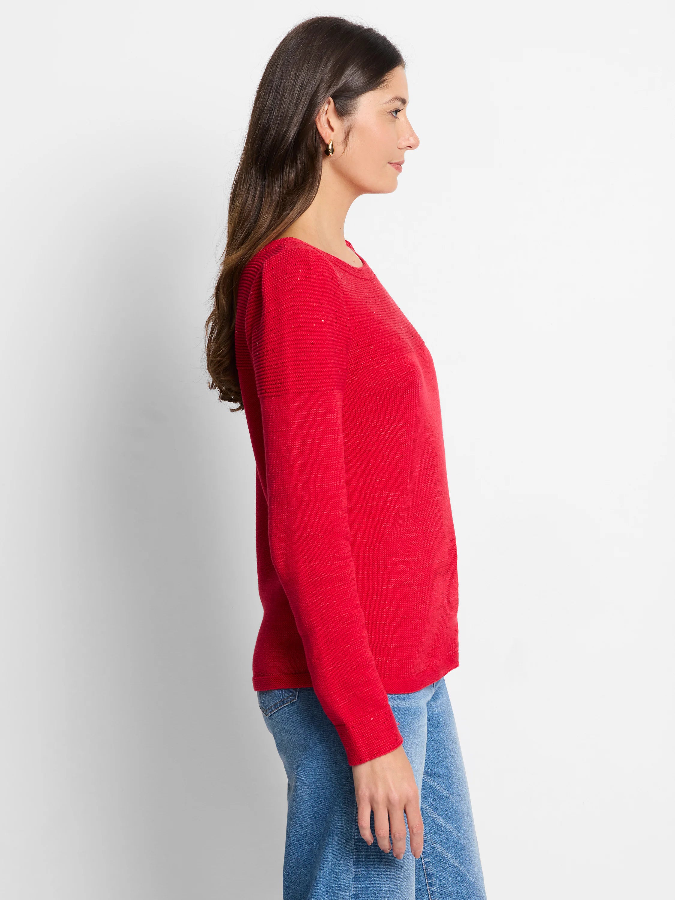 Red knit sweater with subtle sequin detailing on the shoulders. Long sleeves, round neckline.