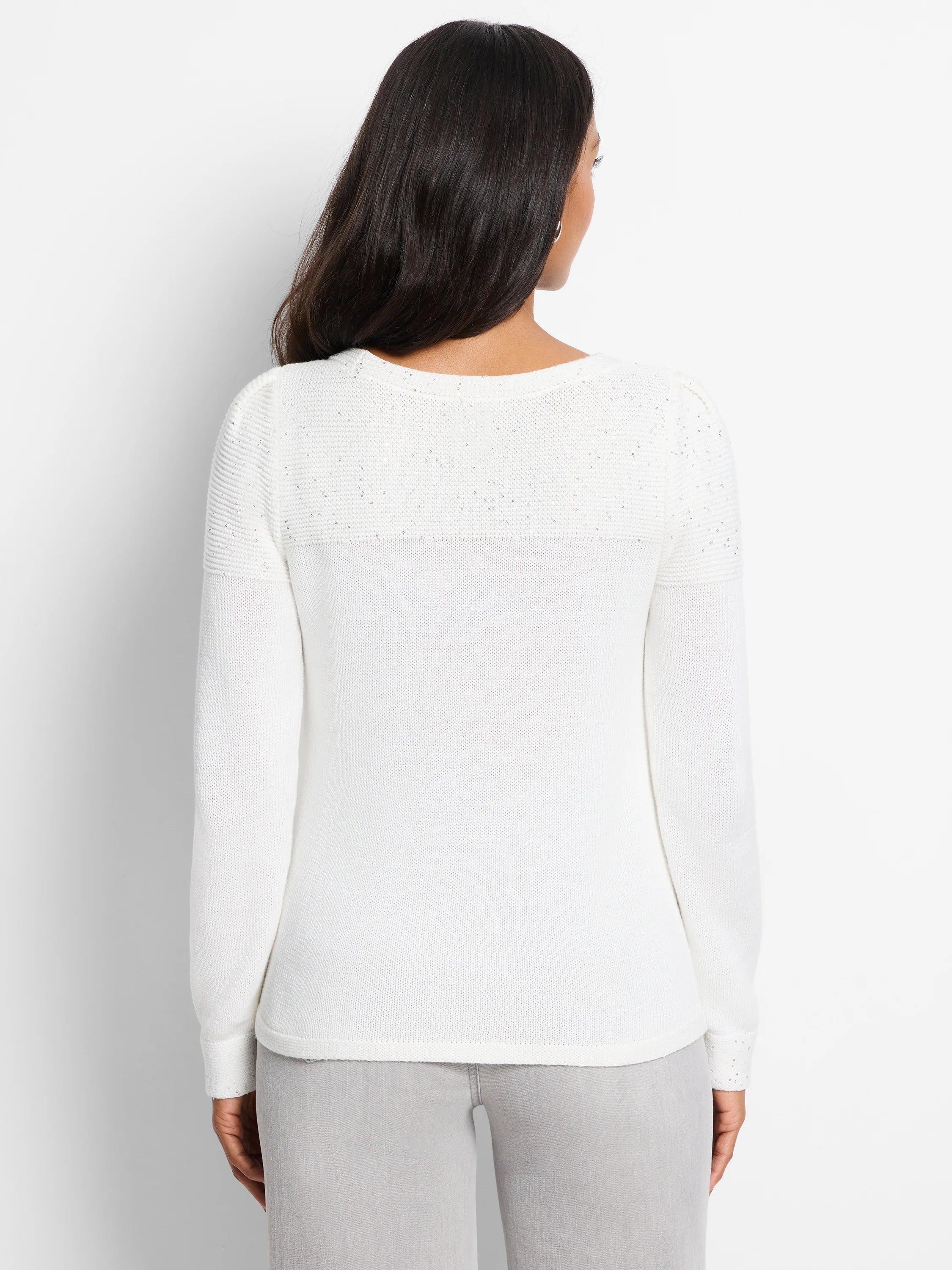 Off-white sweater with subtle sequin detailing on the shoulders and cuffs. Long sleeves, crew neck.