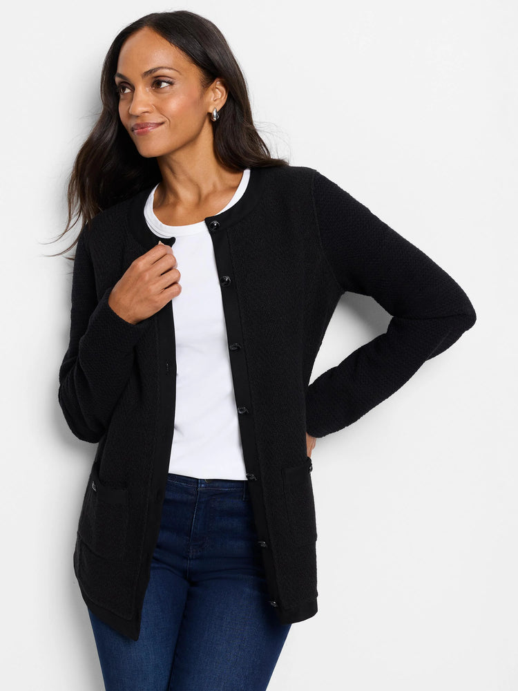 Black knit button jacket, textured fabric, black buttons, and patch pockets.
