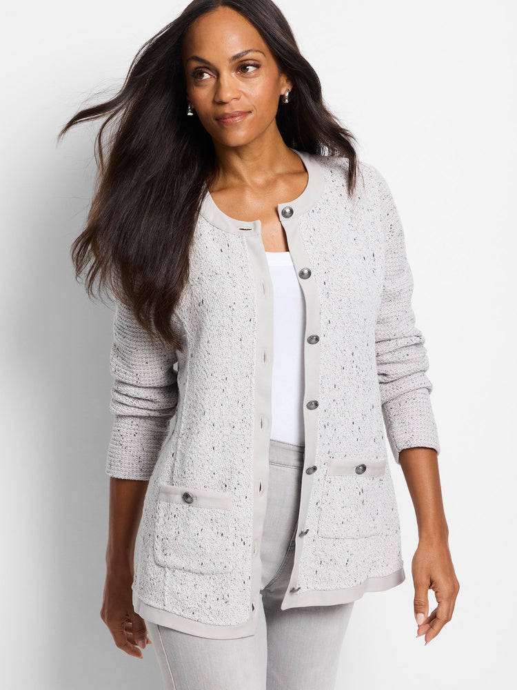 Light gray knit jacket with darker gray flecks, button front, and pockets. Silver buttons.