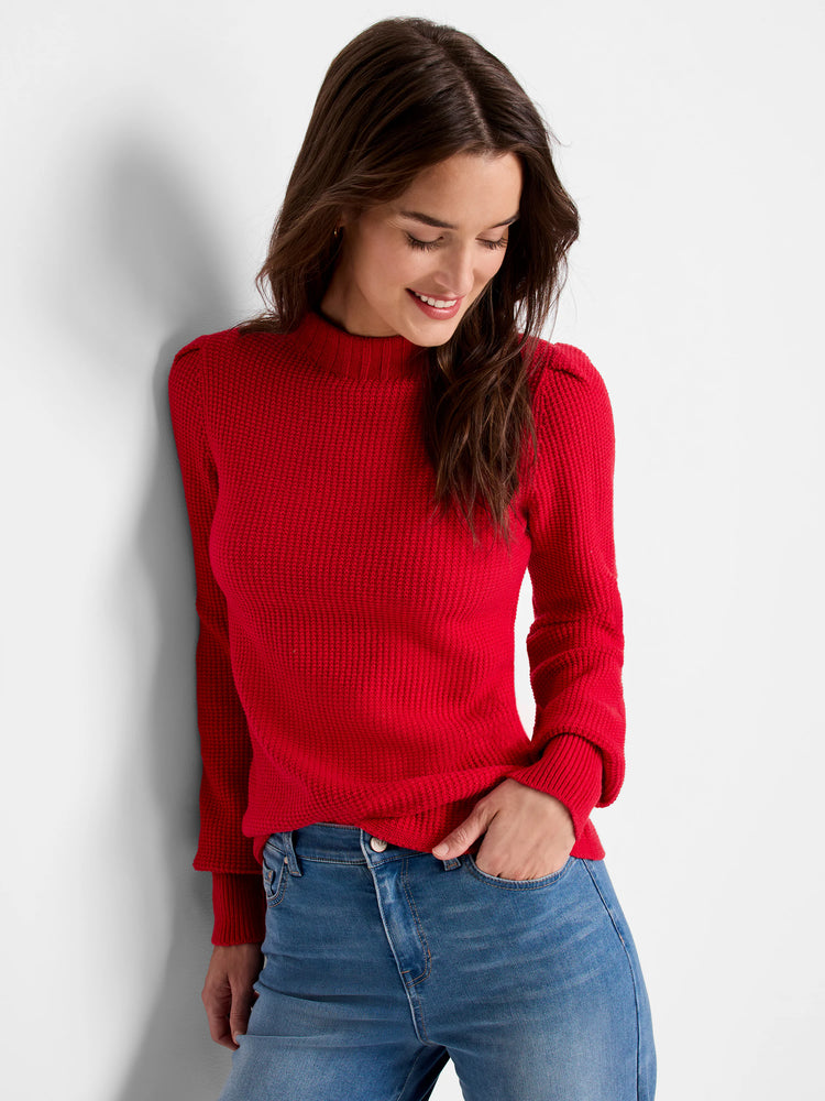 Red waffle-knit sweater, long sleeves, mock neck. Slightly puffed sleeves.