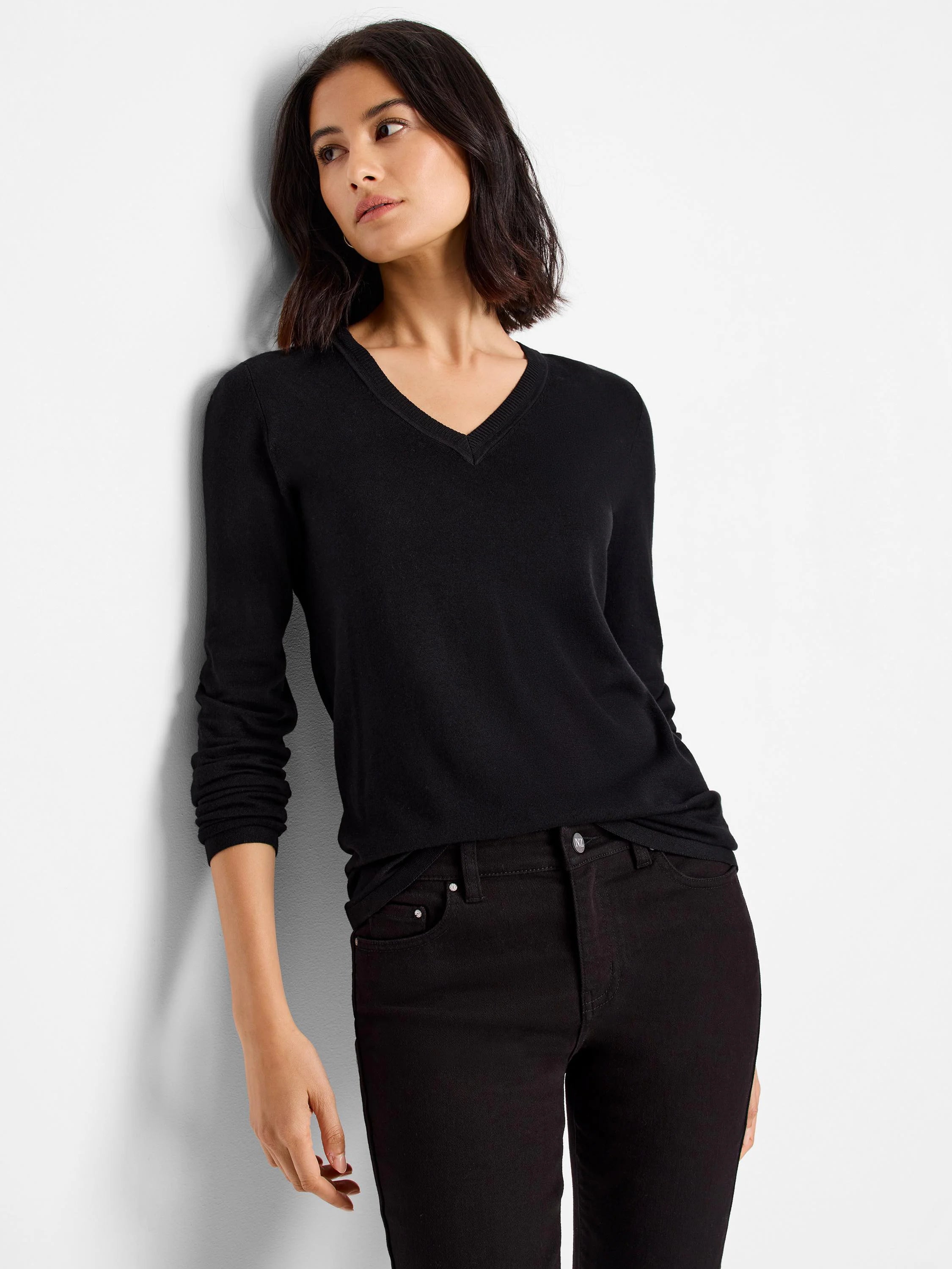 Black V-neck sweater tee; long sleeves.