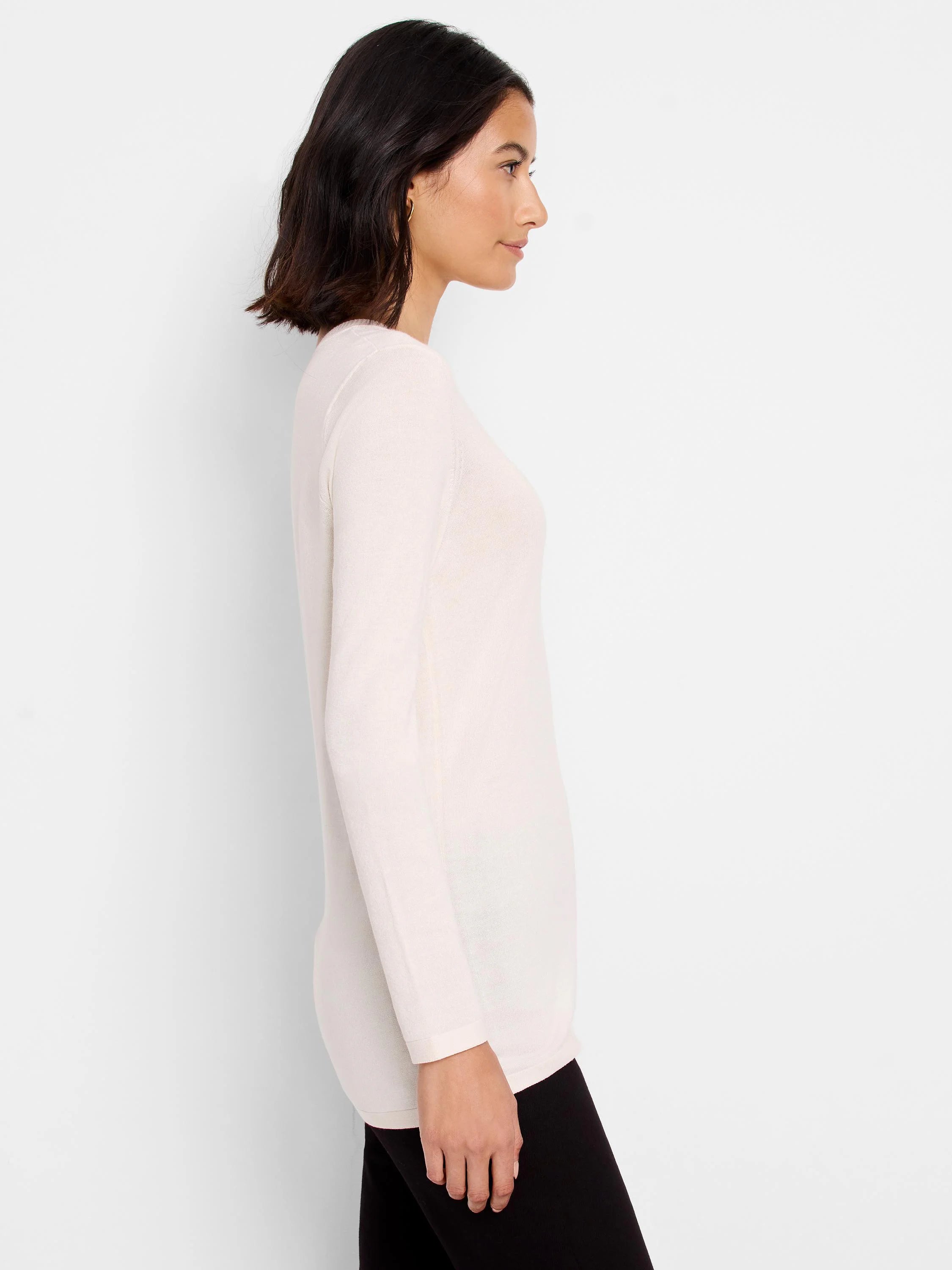 Off-white V-neck long-sleeve sweater tee. Side profile shows fit and fabric texture.