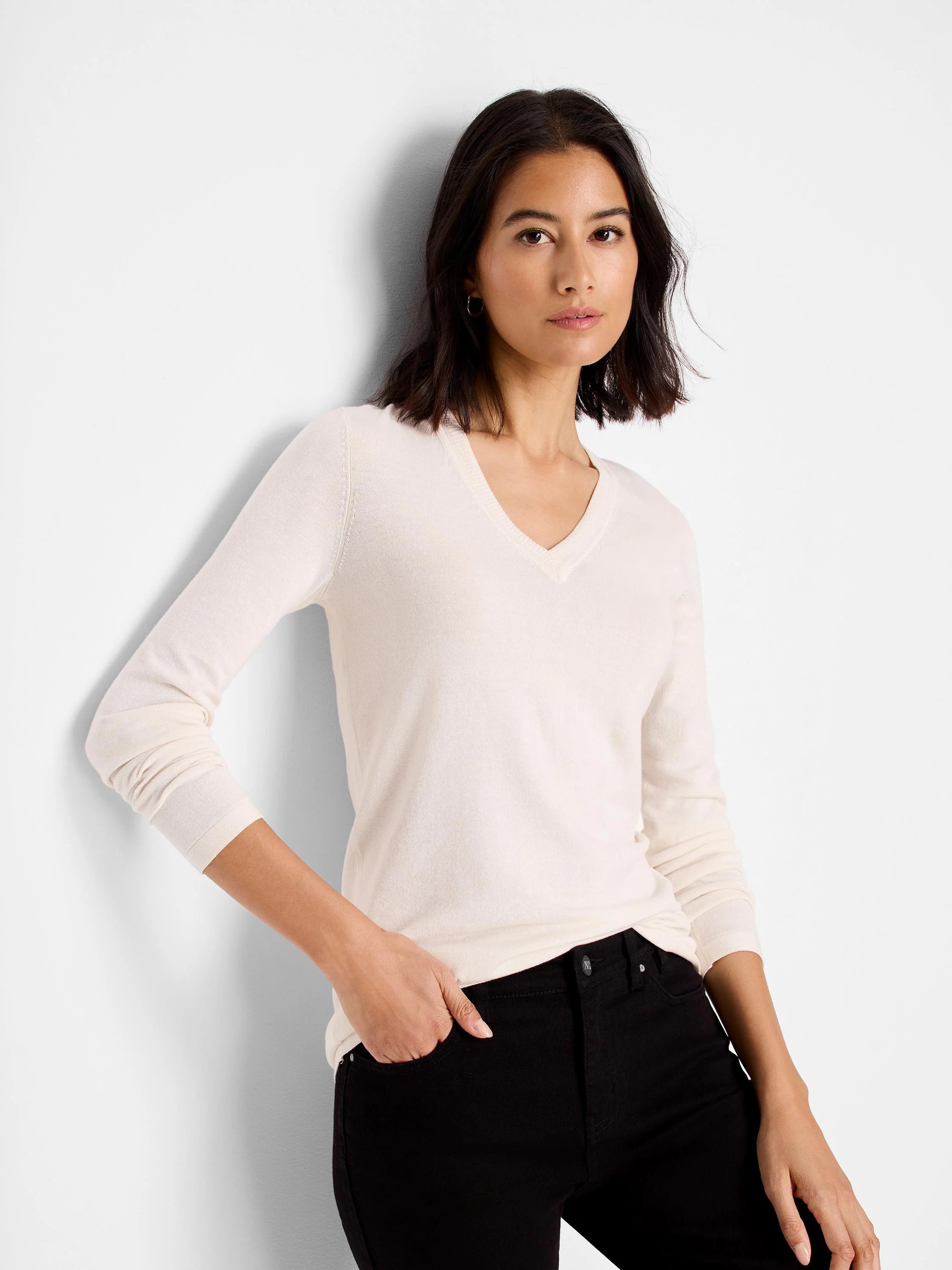 Off-white V-neck sweater tee; long sleeves, smooth knit fabric.