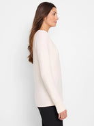 Cream garter knit V-neck sweater with long sleeves, ribbed cuffs and hem.