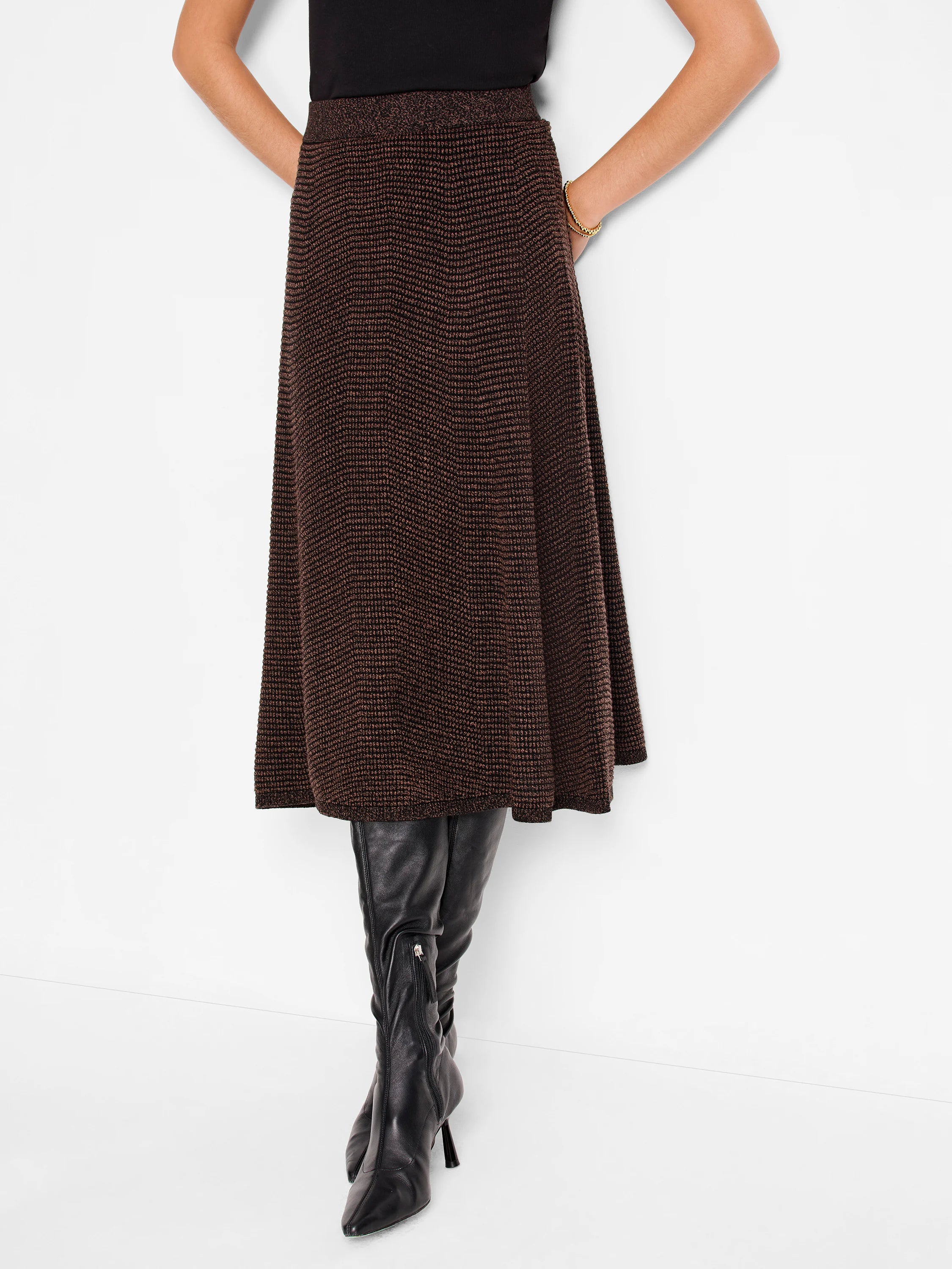 Dark brown pixel knit A-line skirt, textured pattern, mid-calf length.