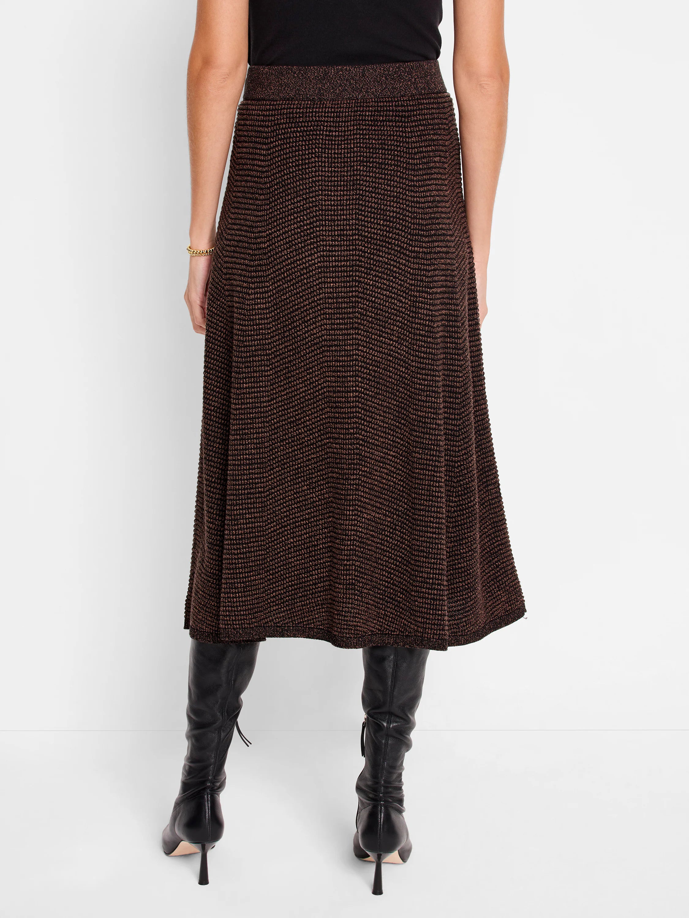 Brown and black knit midi skirt, textured, A-line silhouette. Metallic flecks throughout.