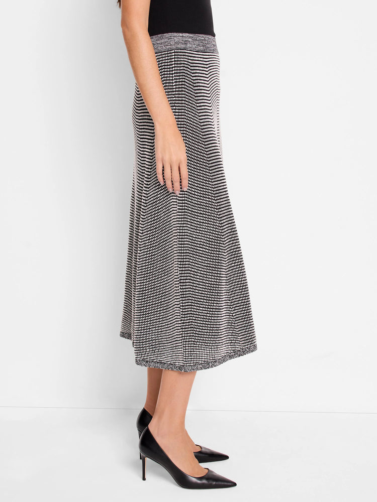 Black & white pixel knit midi skirt with an A-line shape and contrasting grey ribbed trim at the waist and hem.