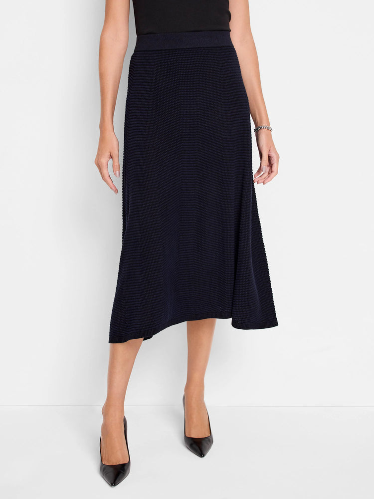 Deep navy pixel knit A-line midi skirt with a ribbed waistband, hitting below the knee.
