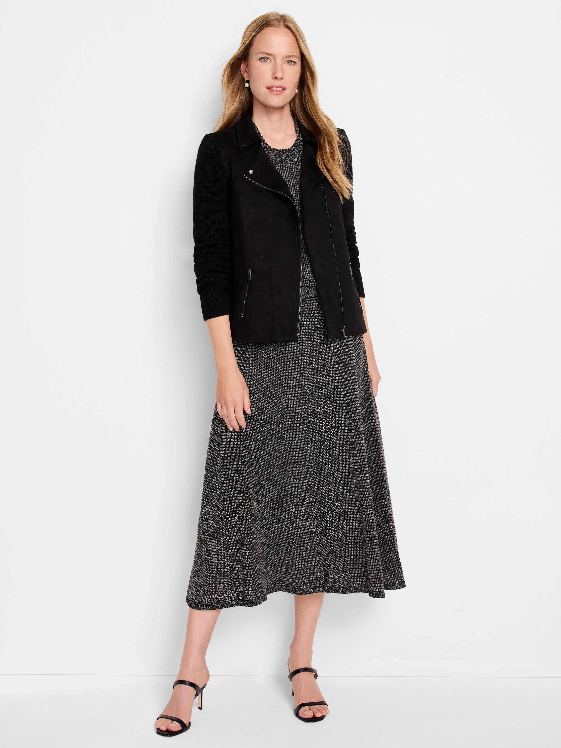 Black midi skirt with a subtle metallic fleck pattern. A-line silhouette.