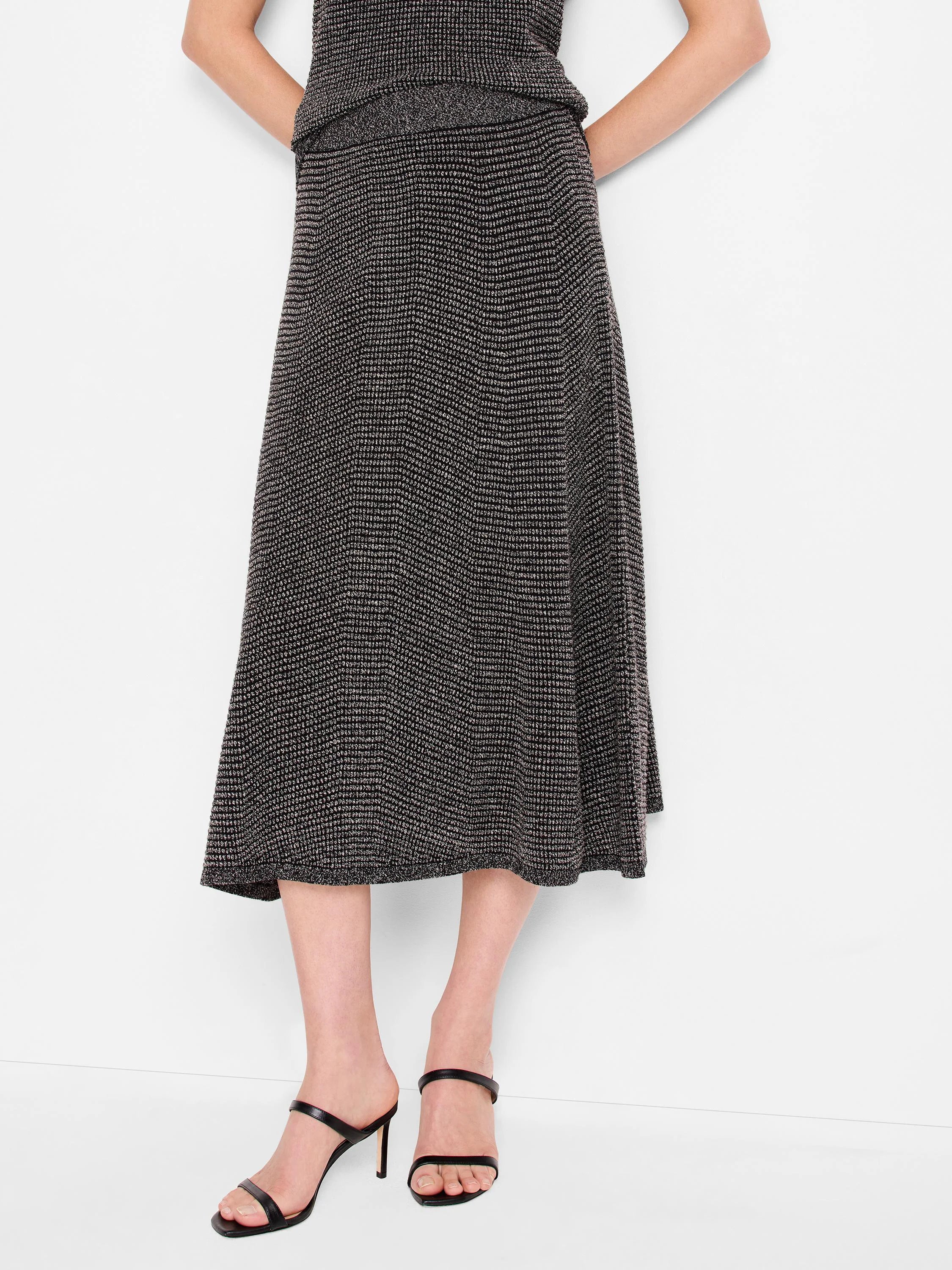 Charcoal gray A-line midi skirt with a light-speckled, pixel knit texture.