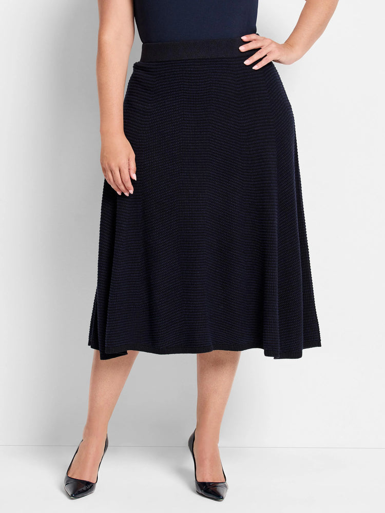 Dark navy A-line midi skirt with textured pixel knit pattern and wide black waistband.