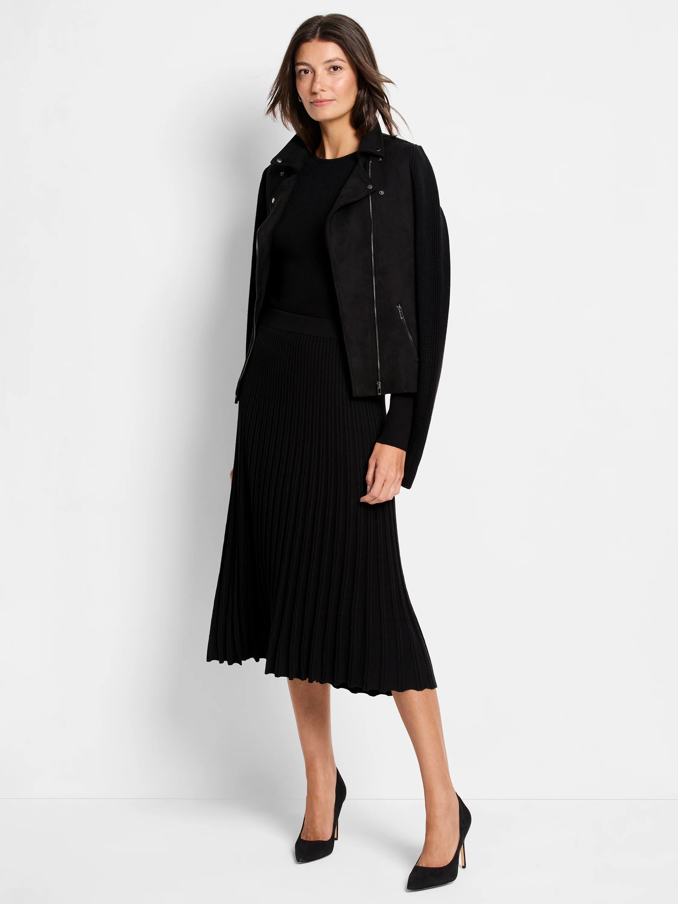 Black ribbed knit midi skirt with a flared, pleated appearance and a scalloped hem.