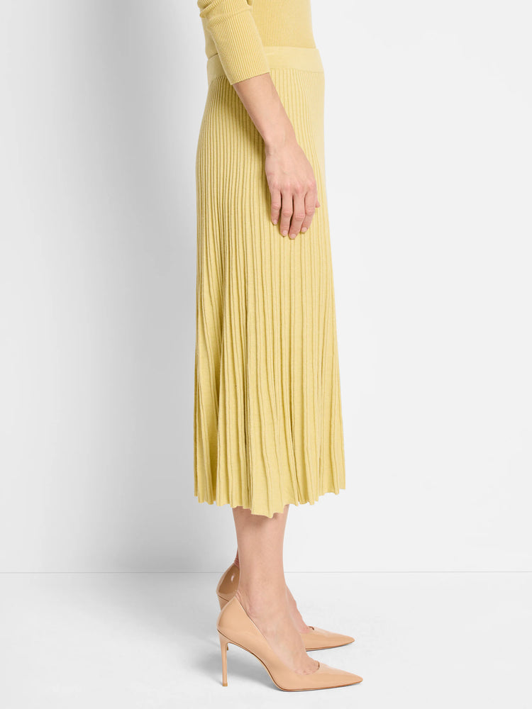 Pale yellow ribbed A-line midi skirt with a smooth waistband.