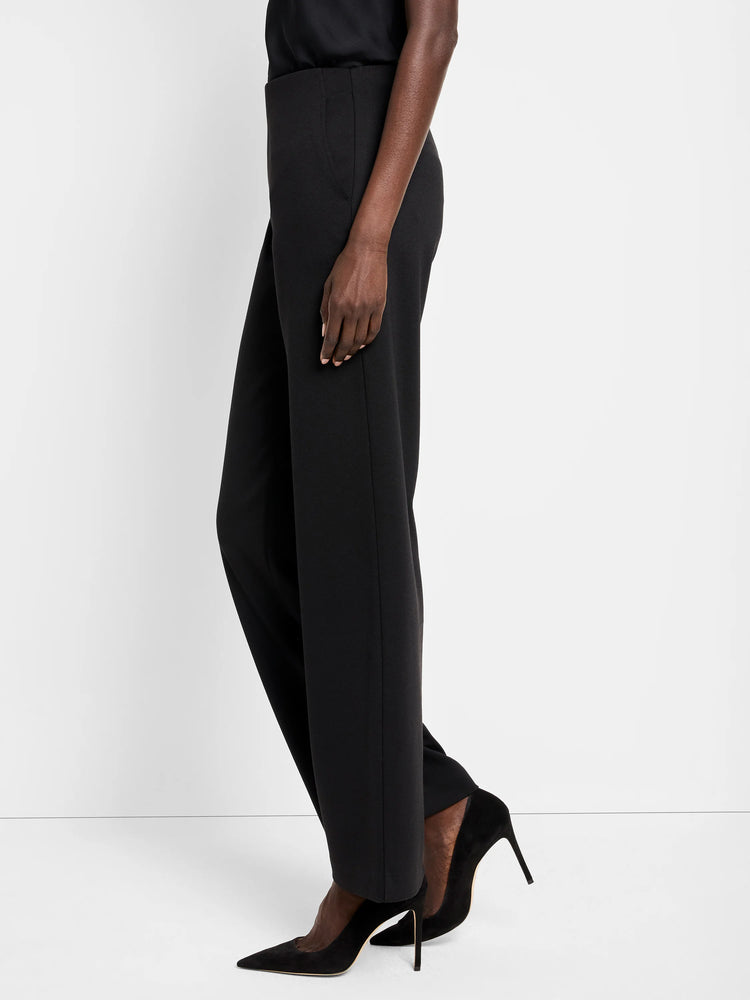Black wide-leg knit pants shown on a model. The pants have a high waist and straight leg.