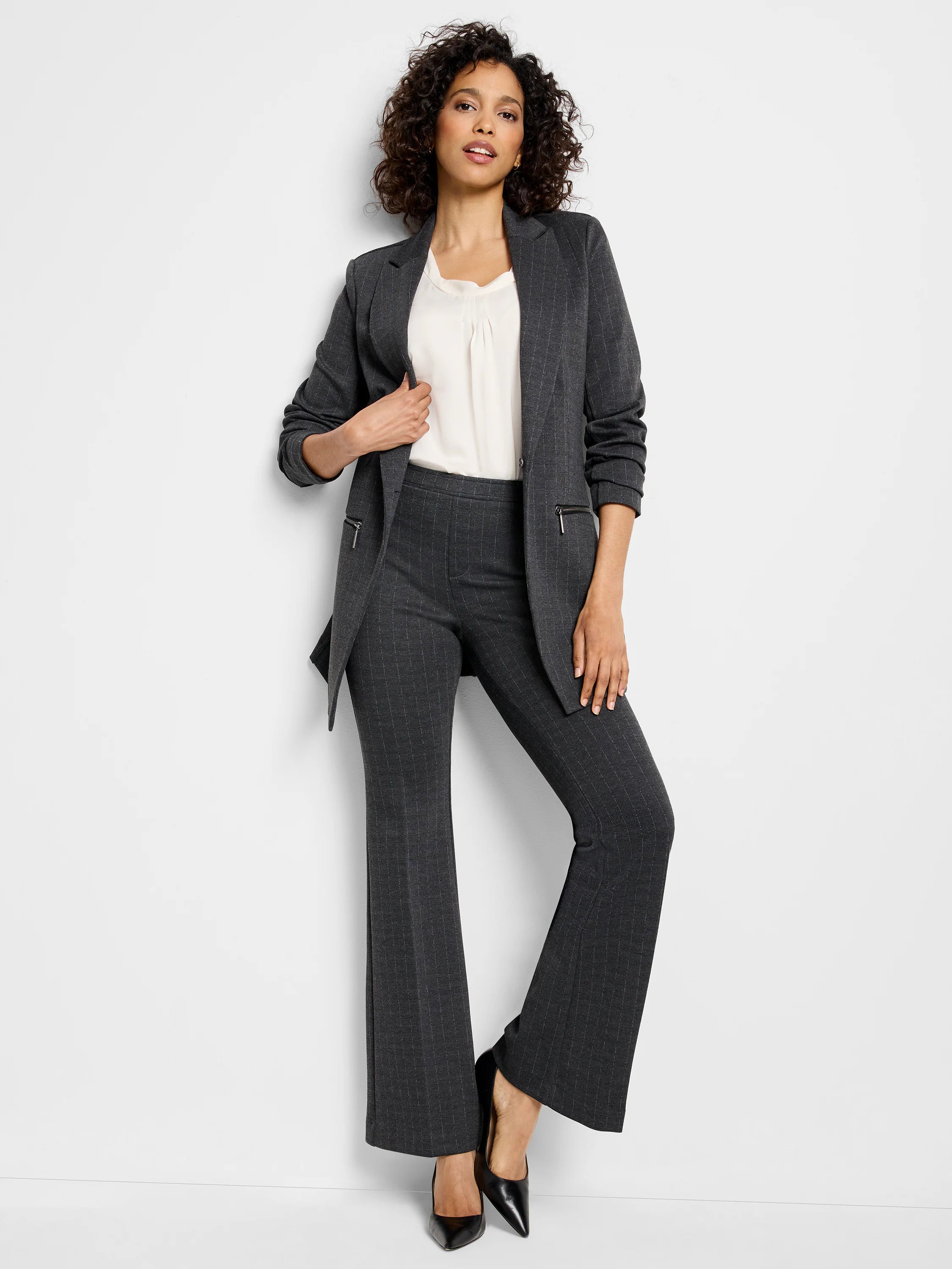Dark gray bootcut pants with thin, lighter gray pinstripes.