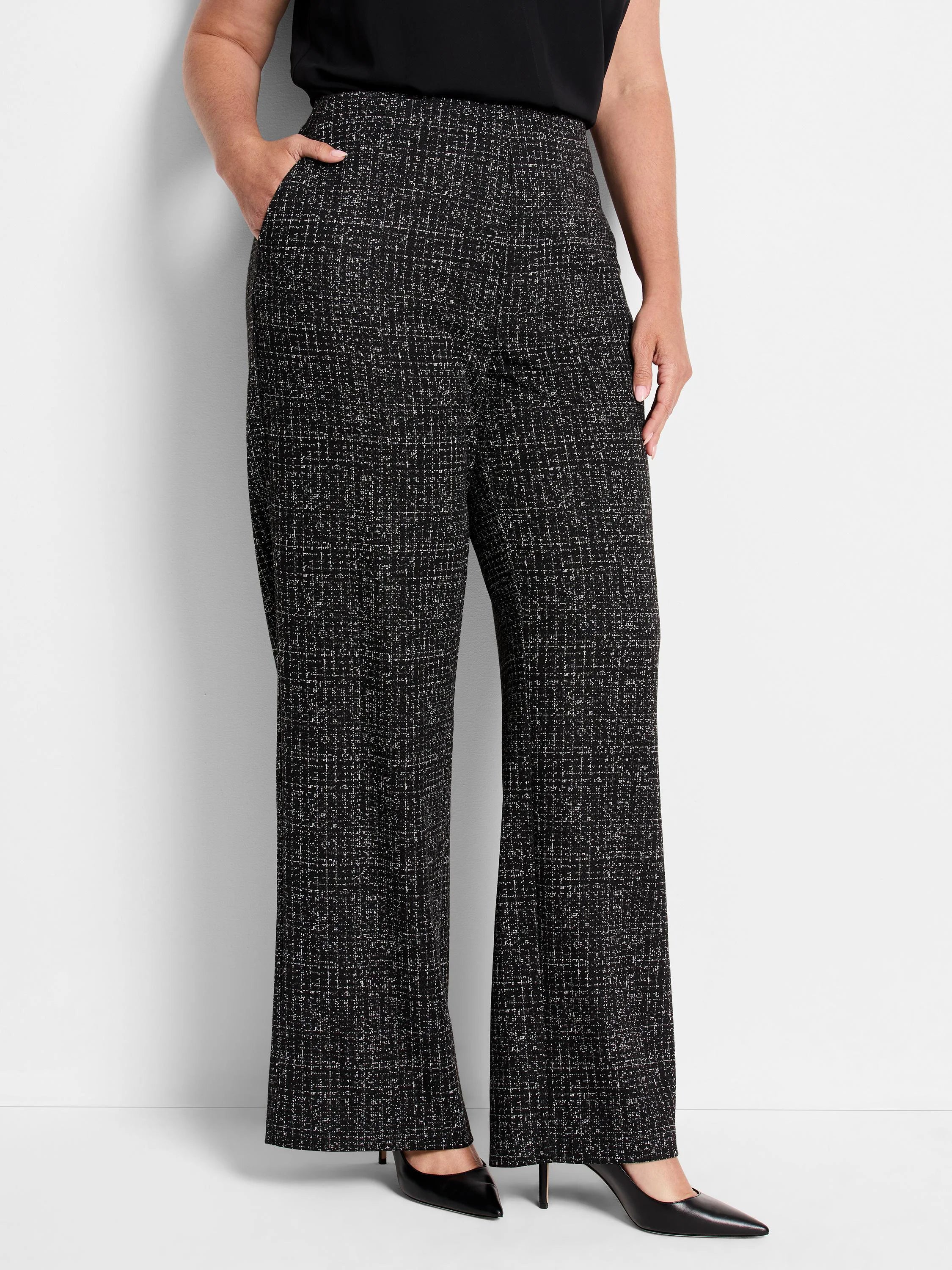 Black wide-leg pants with a small white and grey grid pattern. High waist.