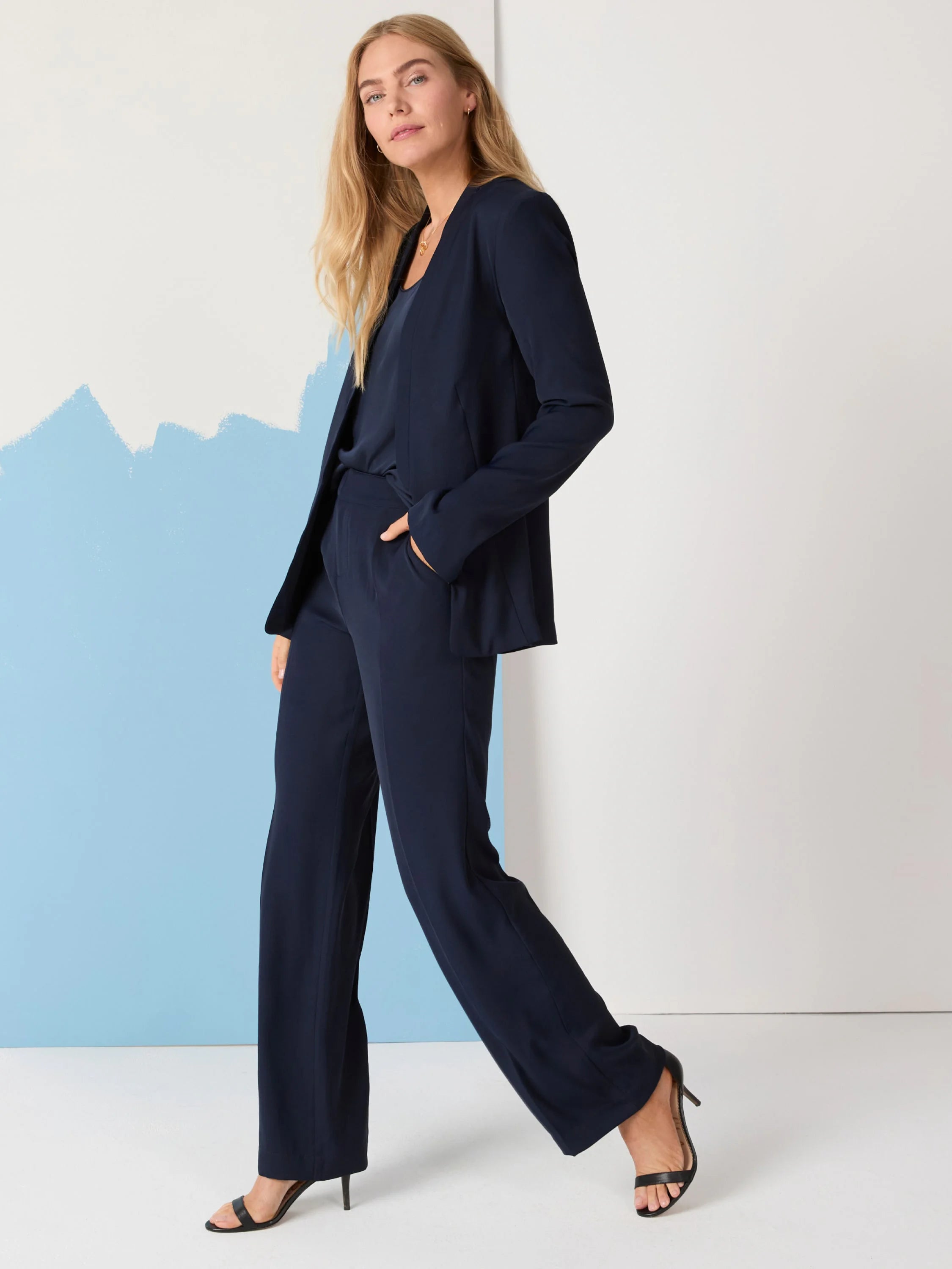 Navy blue blazer and wide-leg trousers. Model is wearing a matching set.