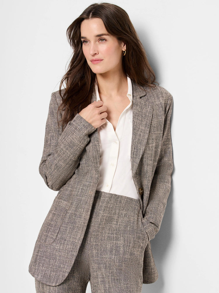 Gray tweed blazer with subtle black flecks. Single-breasted, notched lapel, and pockets.