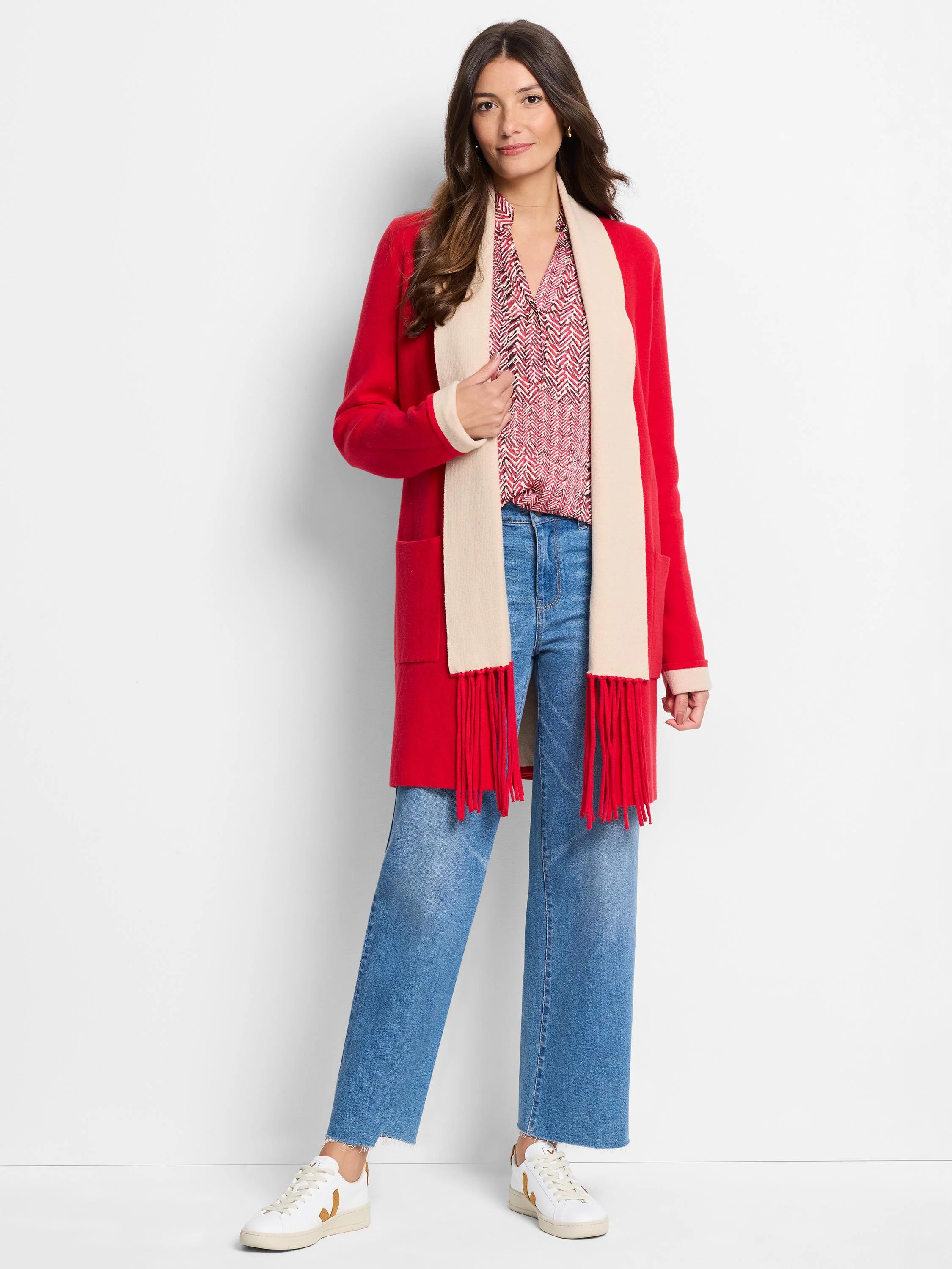 Red cardigan with beige collar and long red fringe. Beige interior visible.