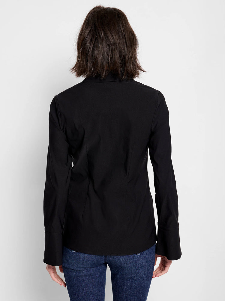 Black long-sleeve shirt, twist front detail, slightly flared cuffs. Shown on model from the back.