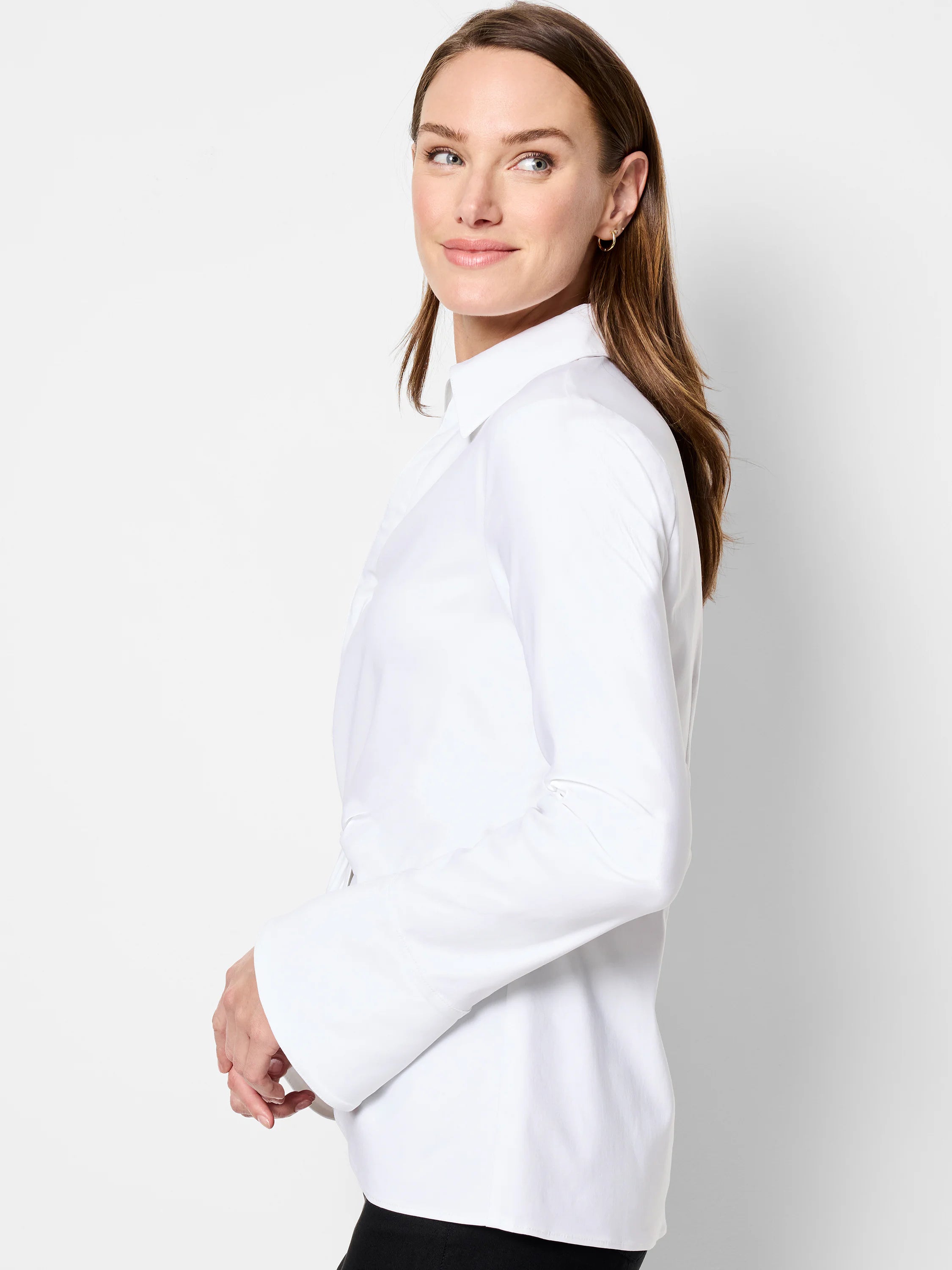 White long-sleeve shirt; collared, twist front, slightly flared cuffs.