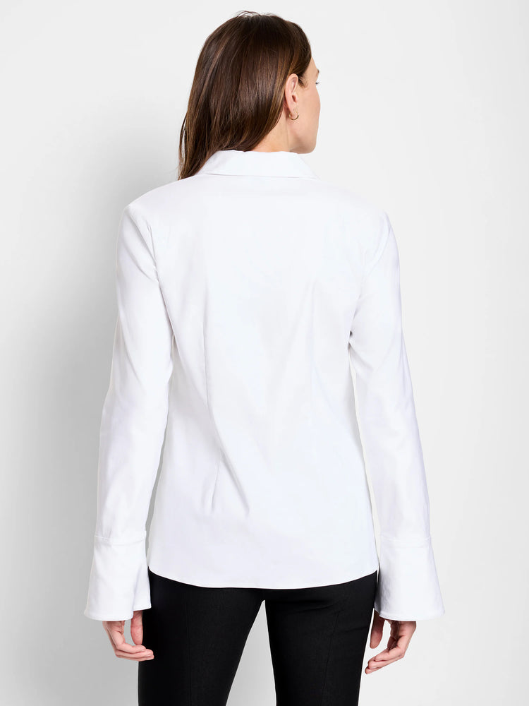 White long-sleeve shirt, shown from the back. Bell sleeves and collared neckline.