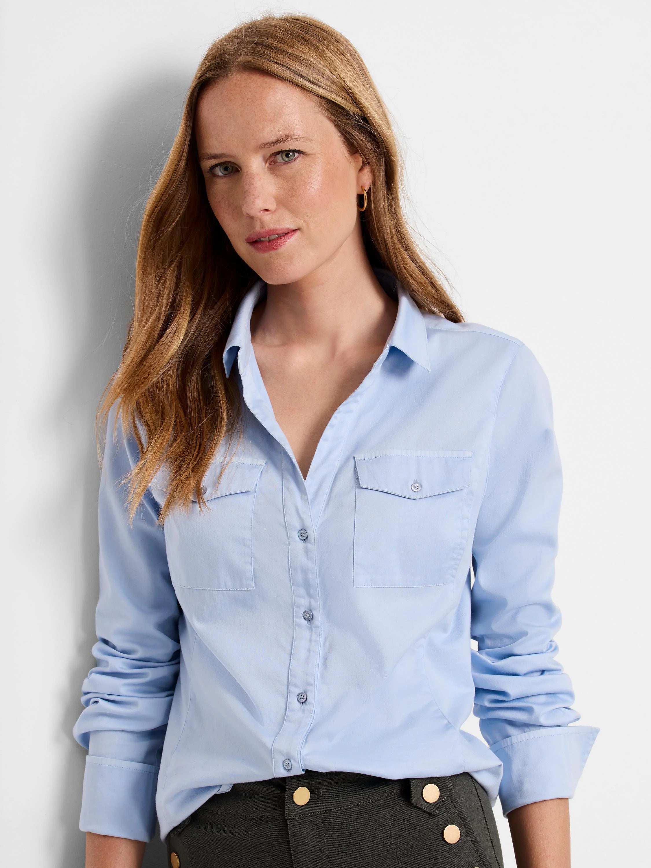 Light blue, long-sleeved button-down shirt; two chest pockets.