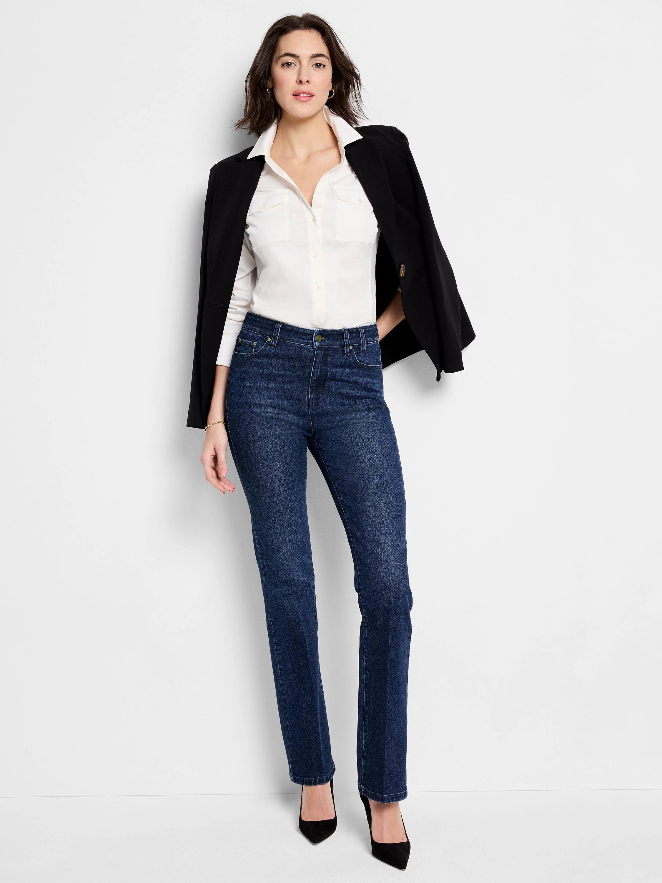Dark wash straight-leg jeans; model wears them with a white shirt and black blazer.