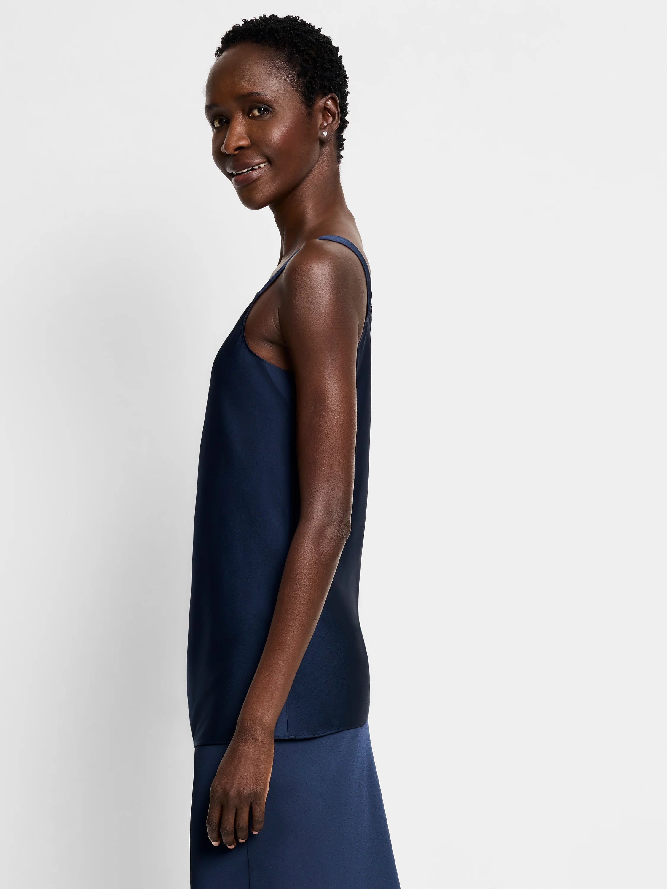 Navy blue sleeveless crepe cami shown on a model.