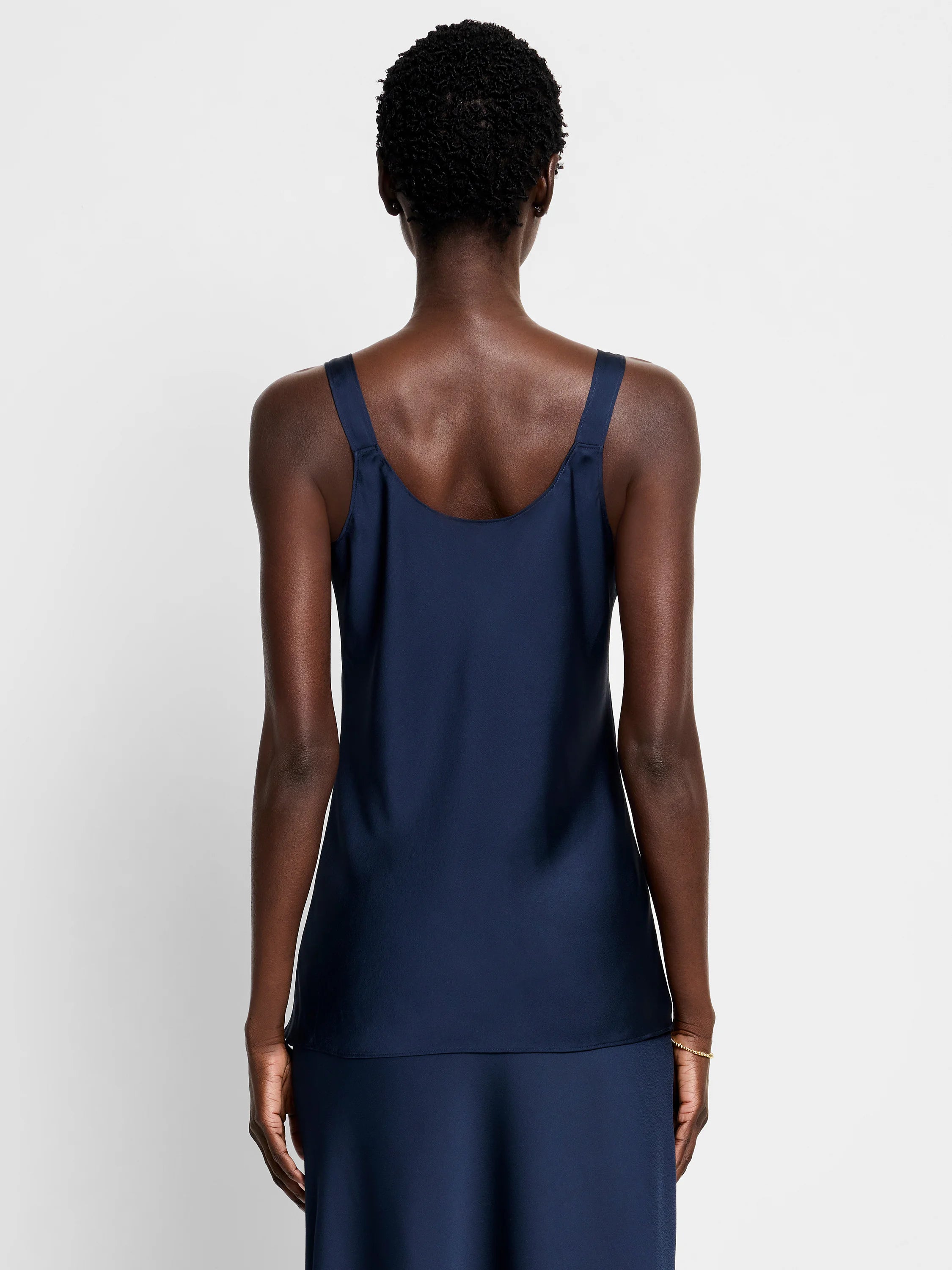 Navy blue crepe cami; sleeveless, scoop neck. Shown from the back.