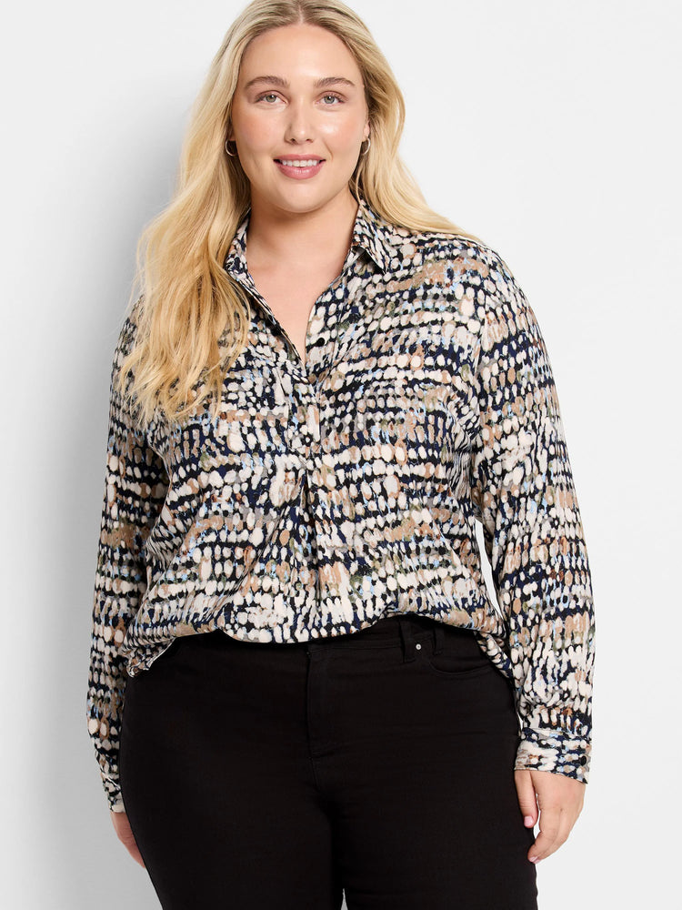 Collared top with an abstract harvest dot pattern in navy, cream, brown, and light blue.