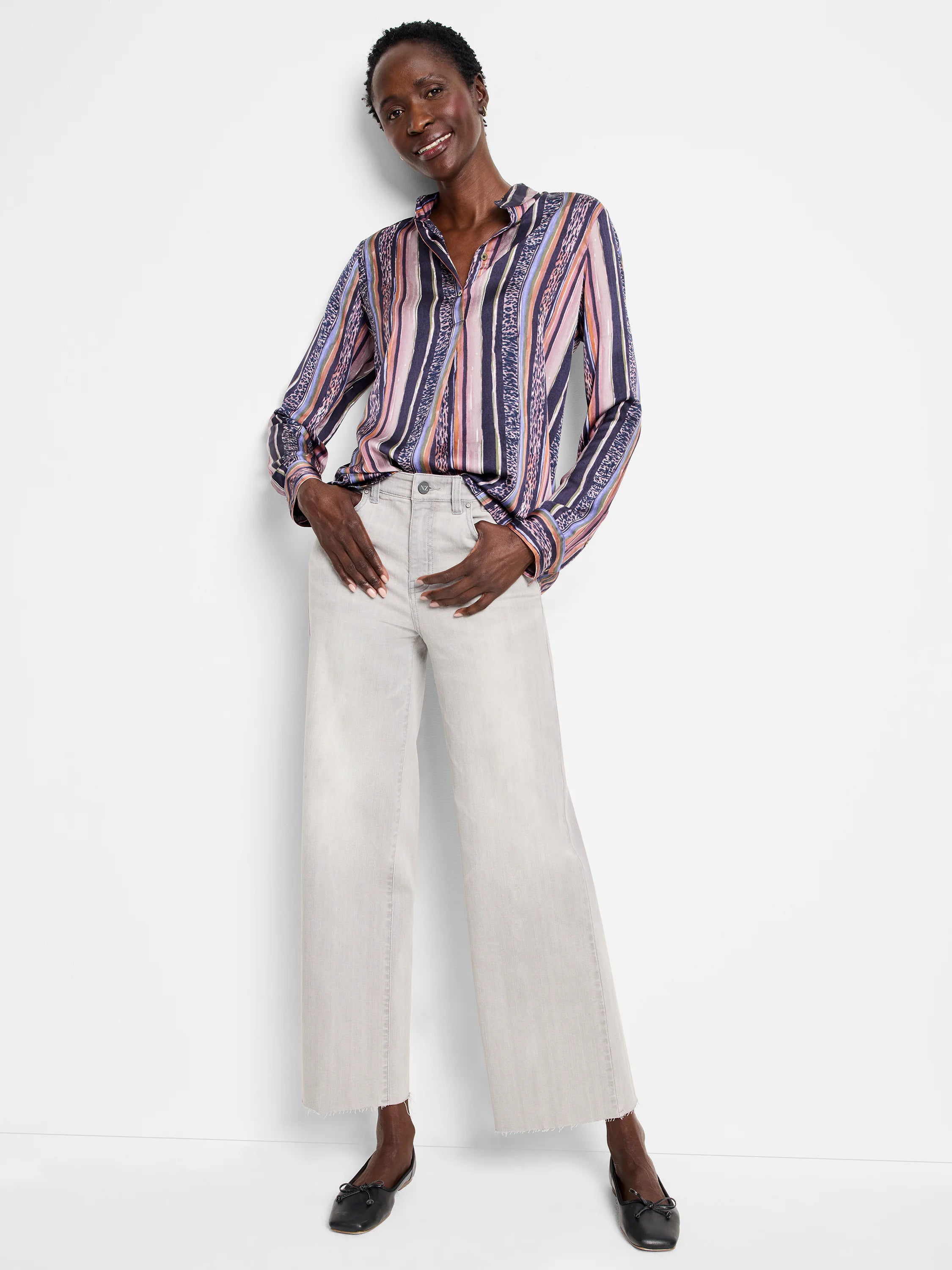 Long-sleeve button-up shirt with vertical stripes in purple, pink, orange, and brown. Some stripes incorporate animal print.