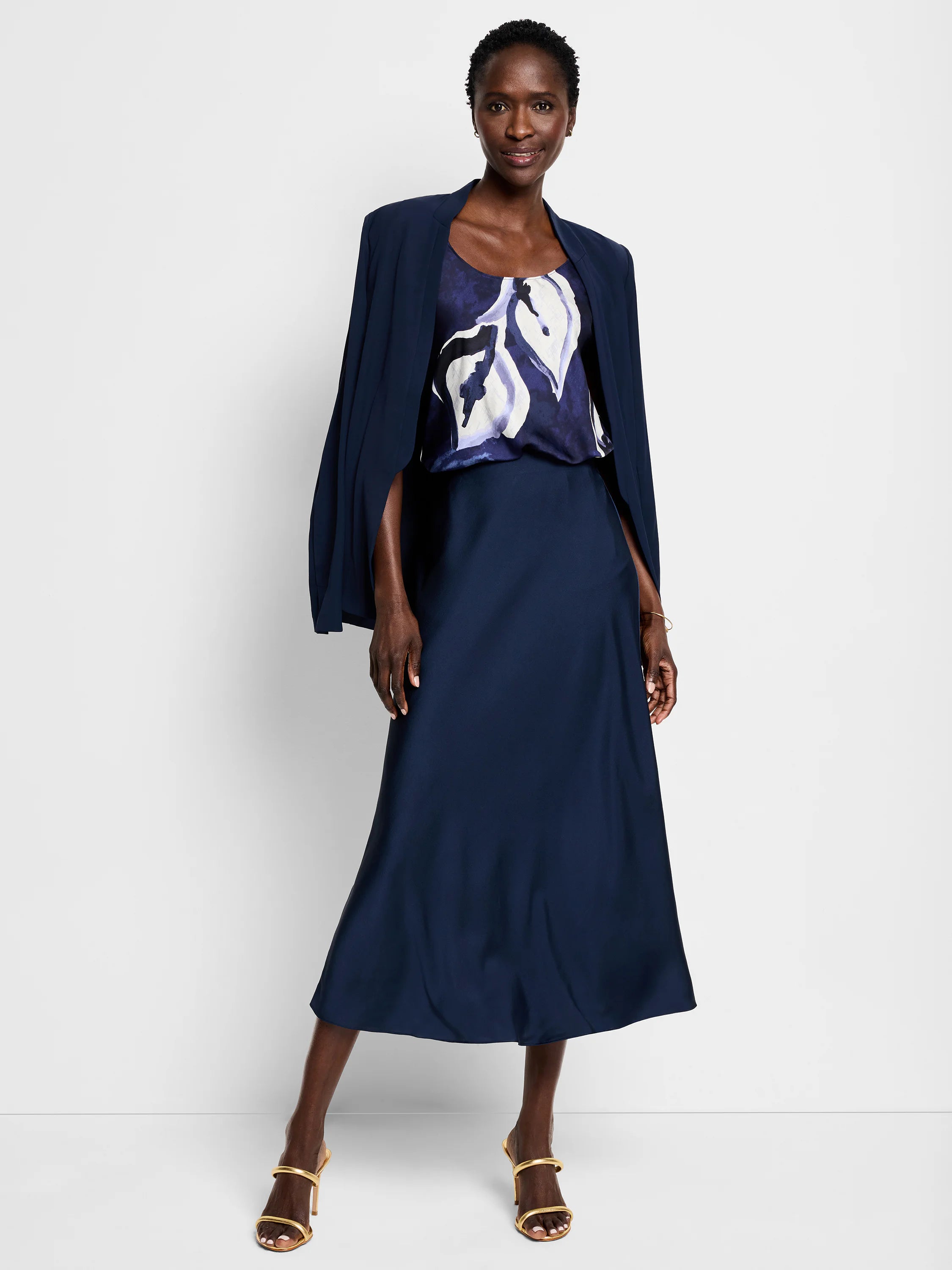 Navy blue cami with abstract watercolor vine design in shades of purple, white, and dark blue.