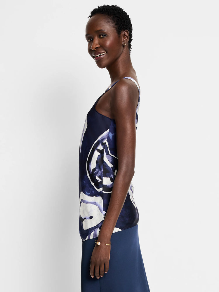 Navy blue cami with off-white and lilac watercolor vine print. Sleeveless, tank-style top.